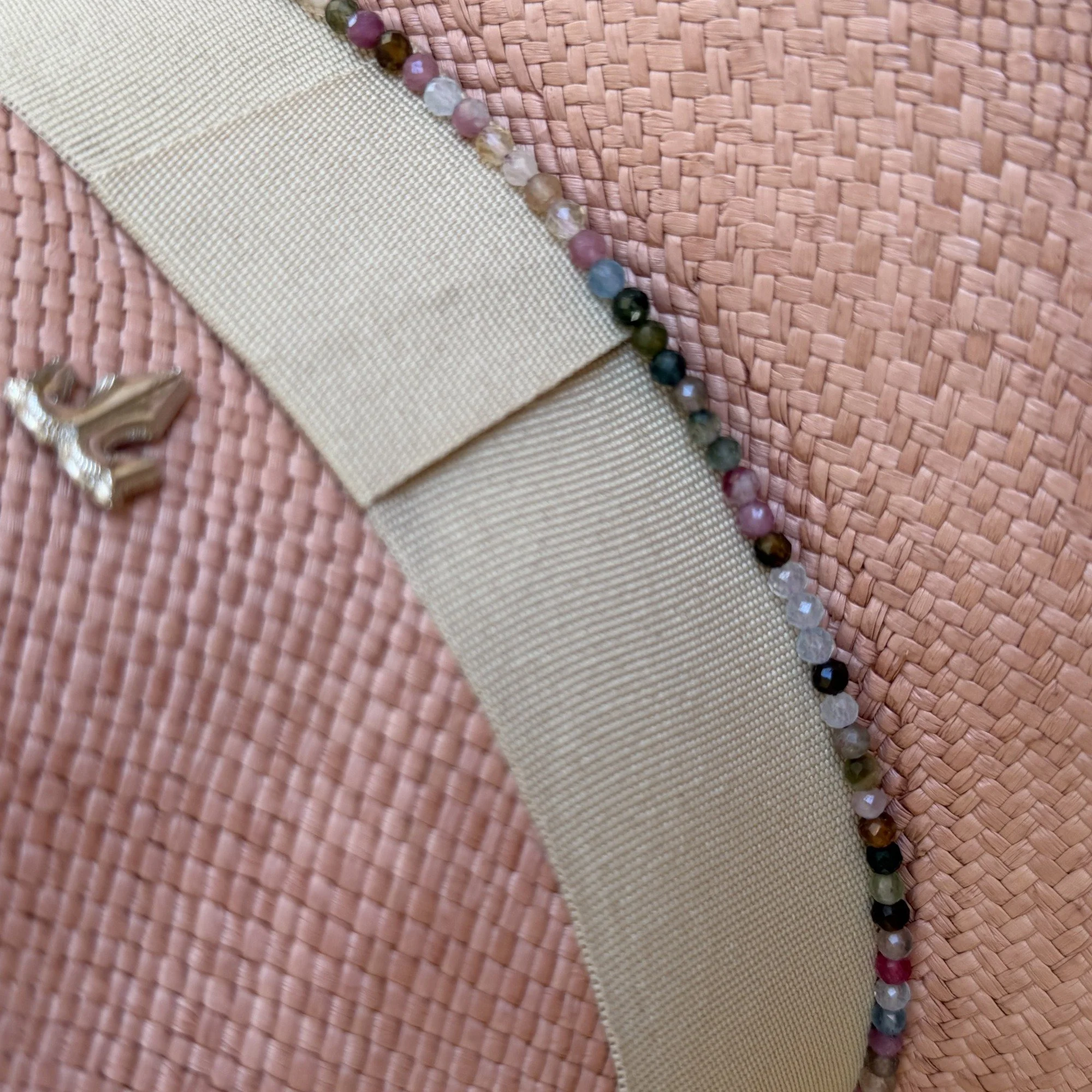 Detail of the ELSIE grosgrain ribbon and tourmaline gemstones, by TESH® Palm Beach.