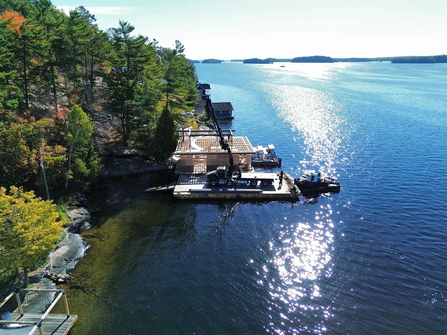 Yesterday&rsquo;s lift on the lake with @coulsonbros &amp; @hummingbirdhomes.

On water, on land, in the middle of town, in the forest,  during half loads (and in every season), we do the heavy lifting for you where you need it, and when you need it.