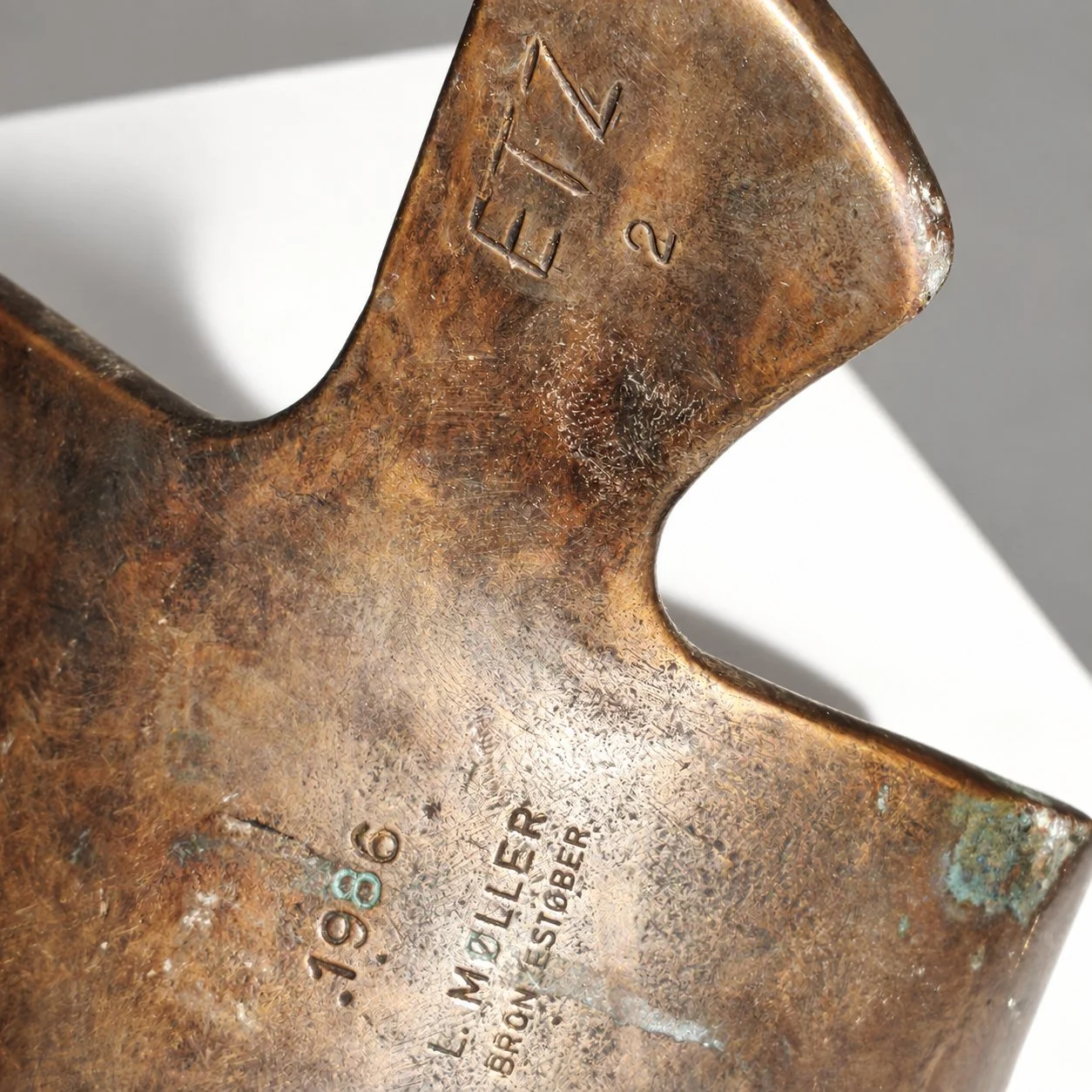 Bronze_bookend_marks_cleaned.jpg