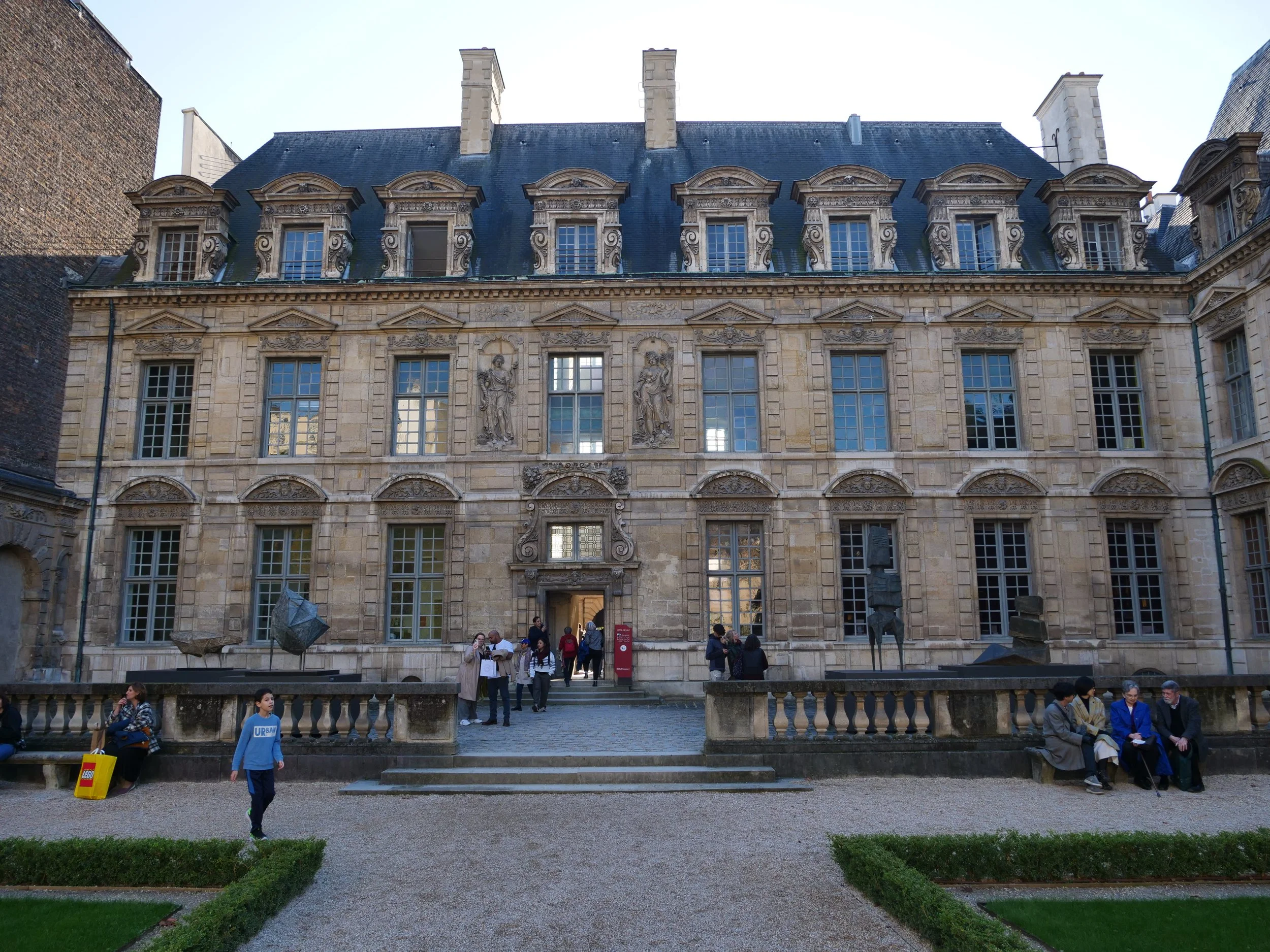 Step into the courtyard of the Hôtel de Sully and admire its intricate stonework and classical beauty.