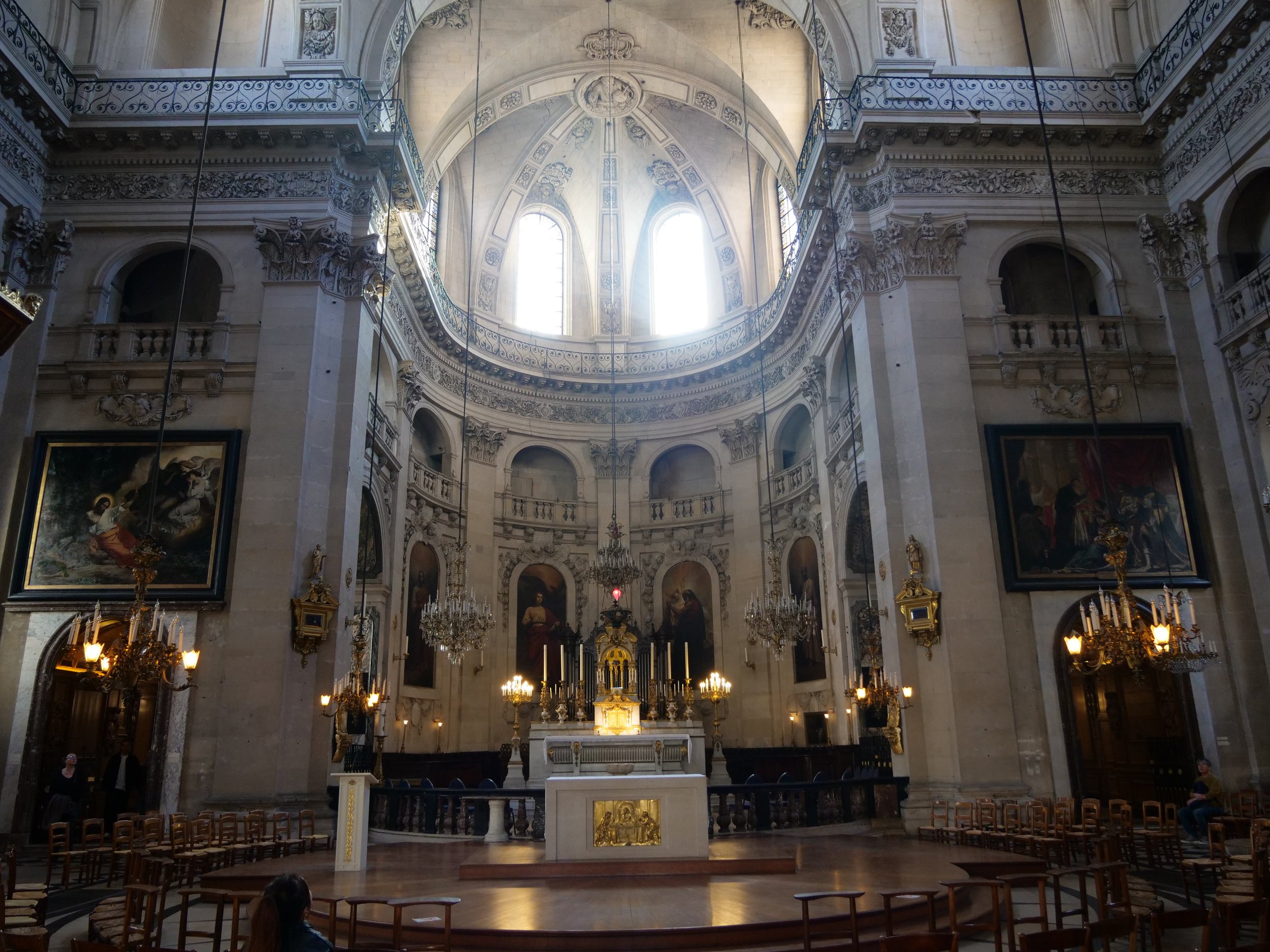 Step inside the Église Saint-Paul-Saint-Louis to experience its grand interior, adorned with stunning religious art.