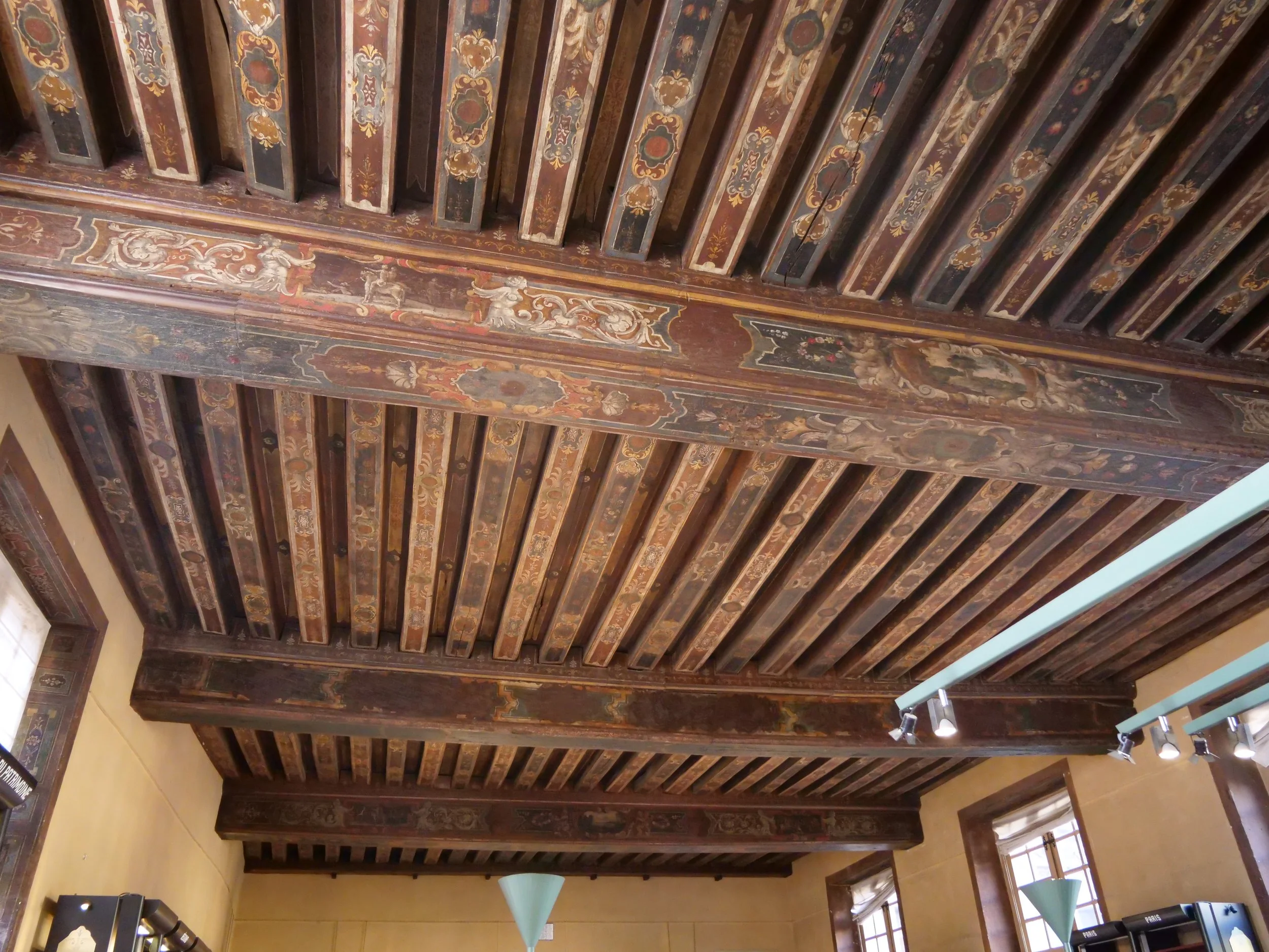 Look up and marvel at the ornate painted ceilings of the Hôtel de Sully, a masterpiece of French artistry.