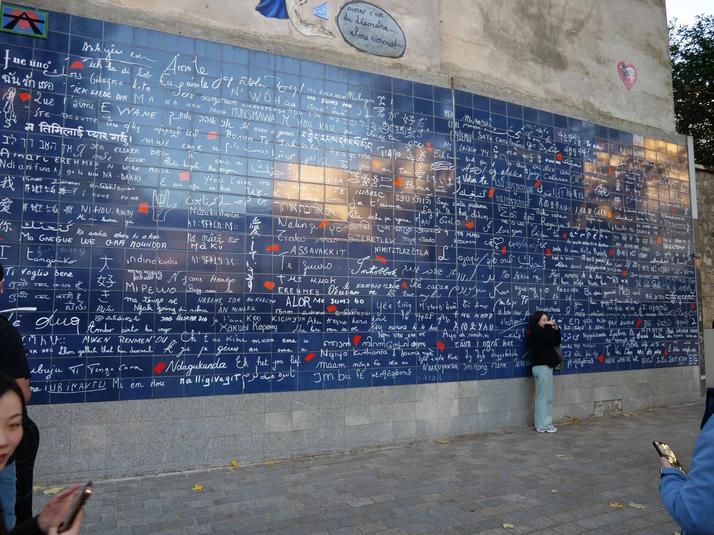 Celebrate love at Le Mur des Je T’Aime, Montmartre’s romantic tribute with ‘I love you’ written in over 300 languages