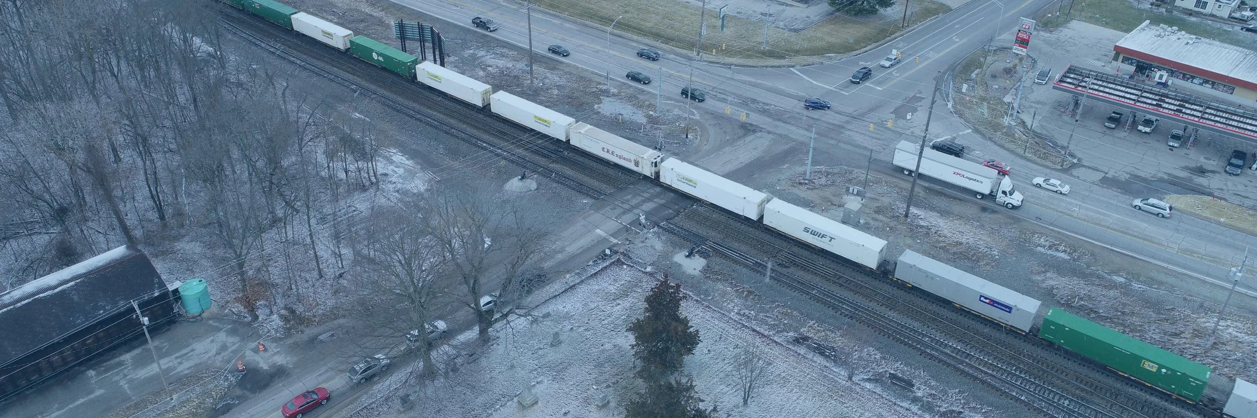 Arial view of  a train crossing an intersection.
