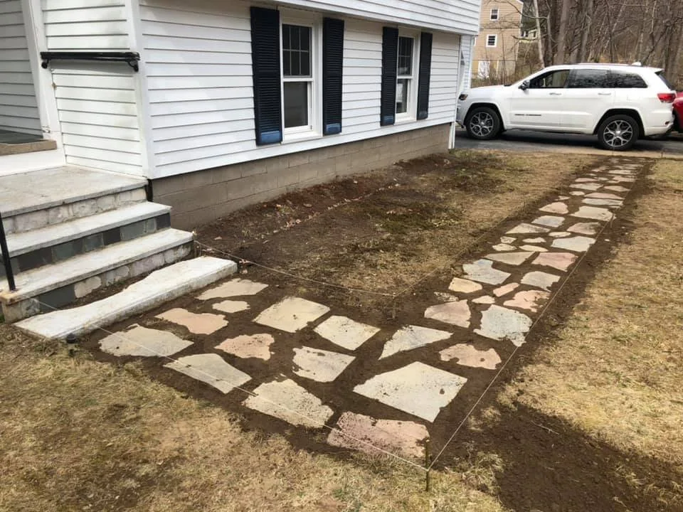 Renewal of the outdoor stone pathway to homes main entrance