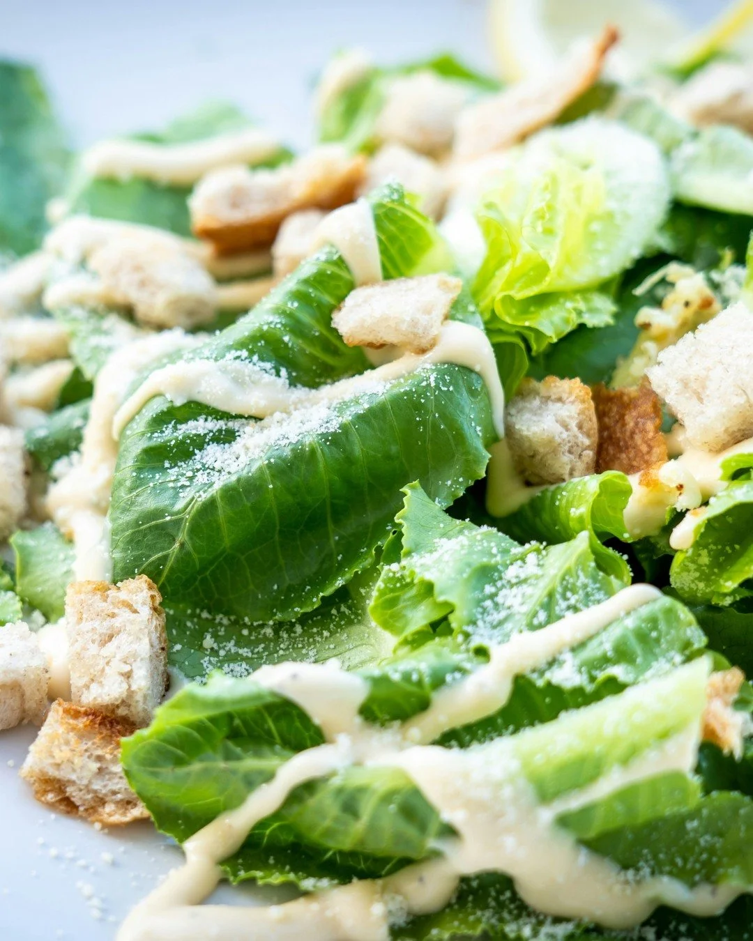 Rich, creamy, and unmistakably savory, classic caesar salad dressing is all about balance. Garlic adds bite, lemon brightens, and Parmesan delivers a salty, nutty finish&mdash;while olive oil creates that signature silky texture. Whether tossed with 