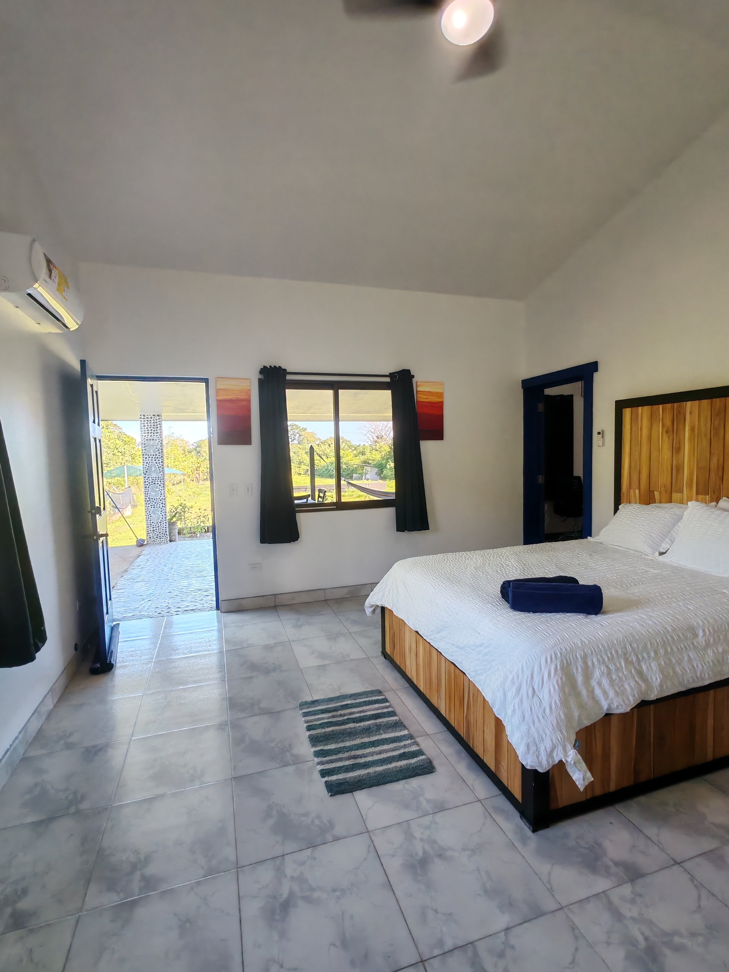 Main bedroom with queen bed and luxe linens
