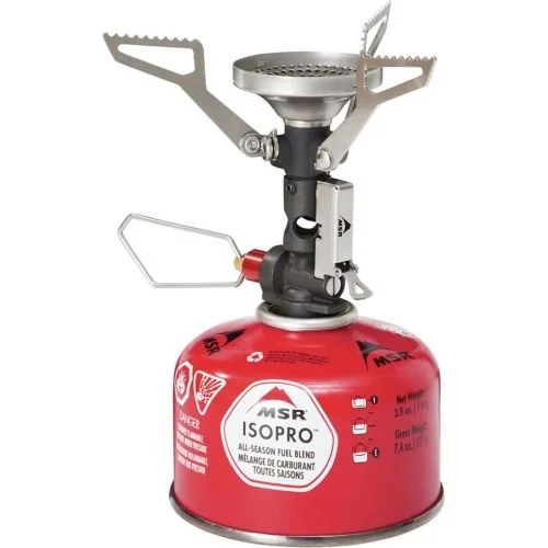 A portable camping stove with a red fuel canister, metal burners, and a control valve.