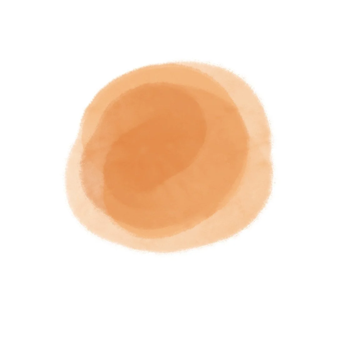 A watercolor style circle shape with a blurred, soft focus effect.