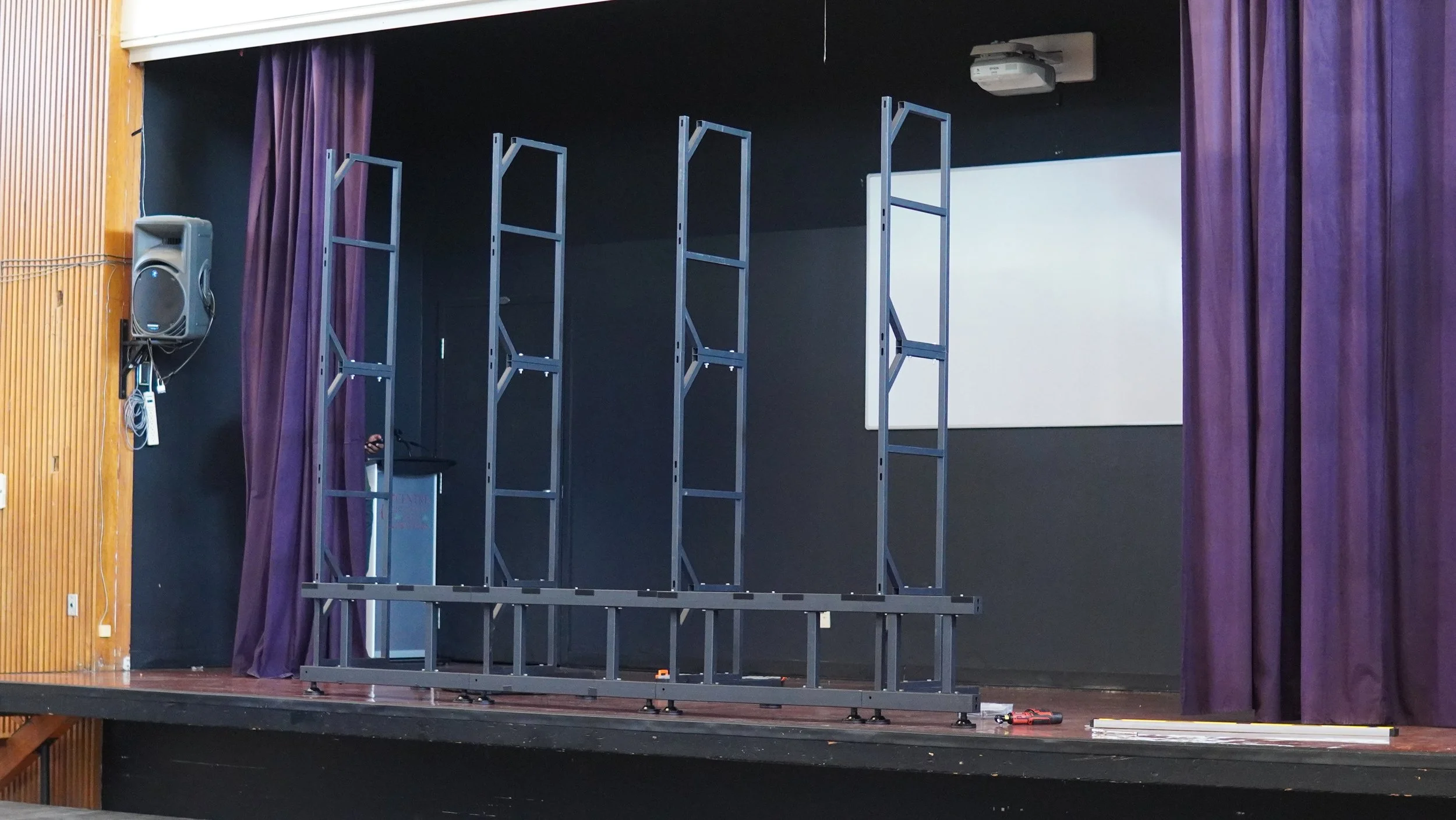 Technical setup for LED wall installation in school auditorium stage