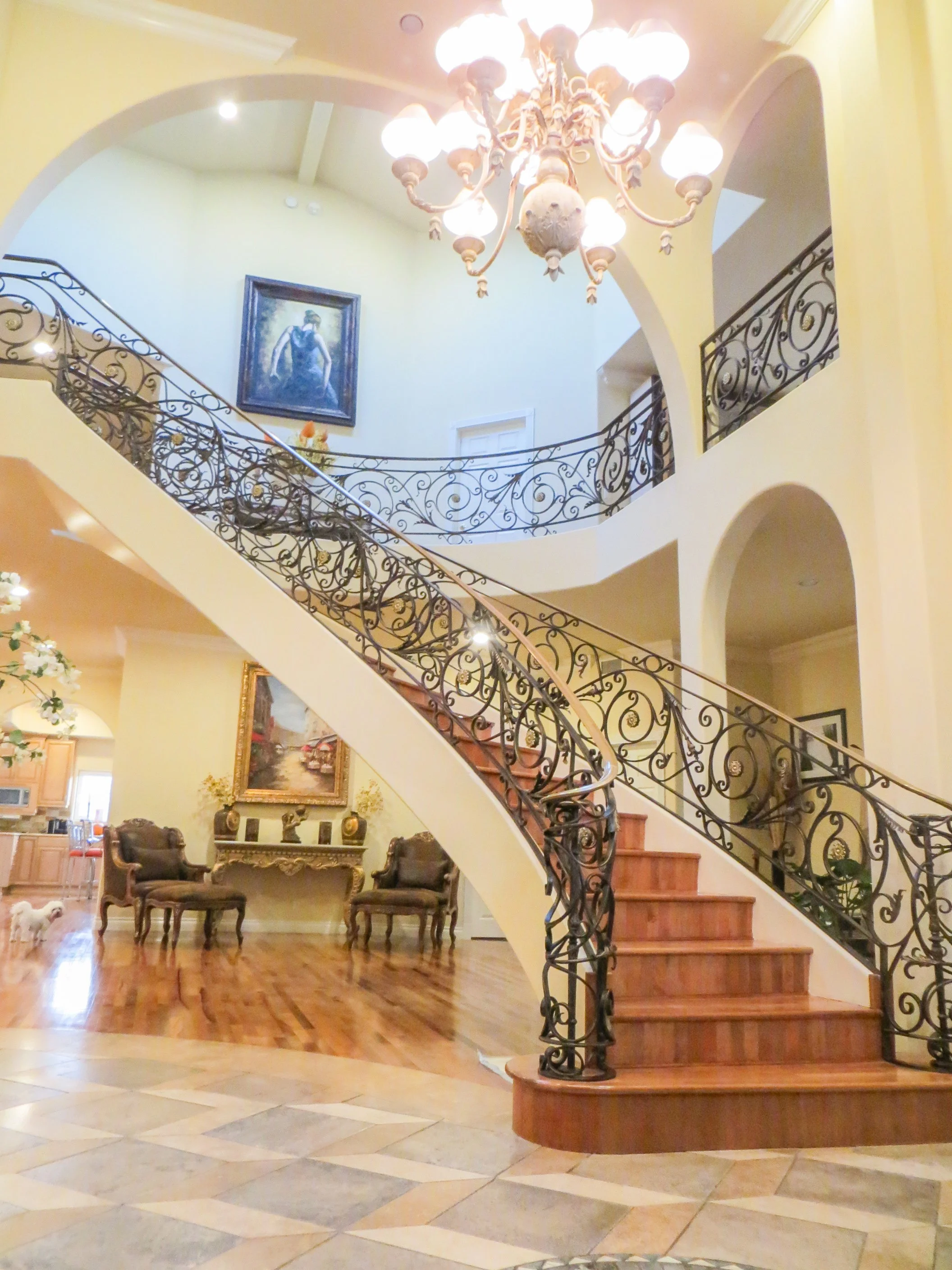 Grand entrance with twisting stairs, even the space is limited, I designed the entrance to improve the space.