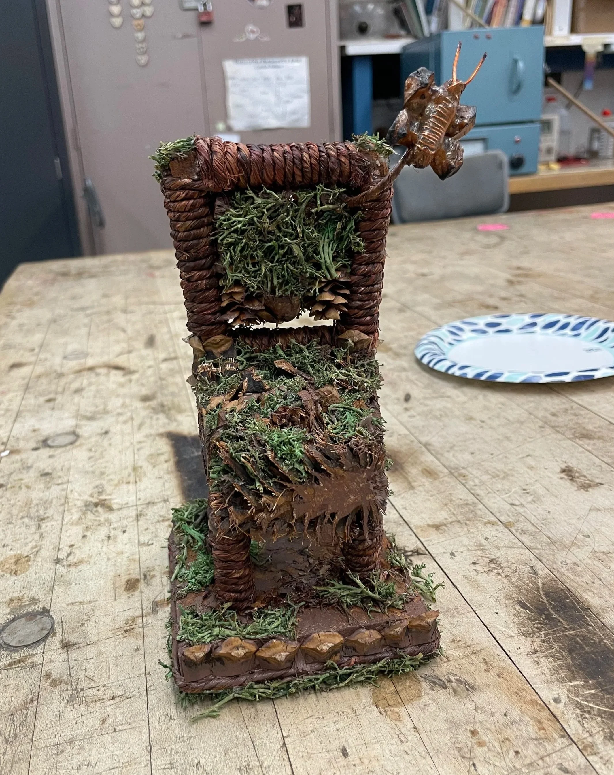 "Branches of a Butterfly" [Pinecones, Wood, Moss, Wire, Adhesives, Paint & Cinnamon] (2024)