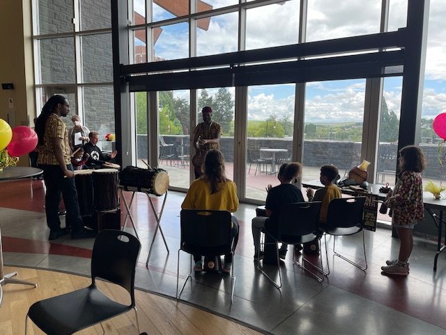 Teaching the youth how to play African drums