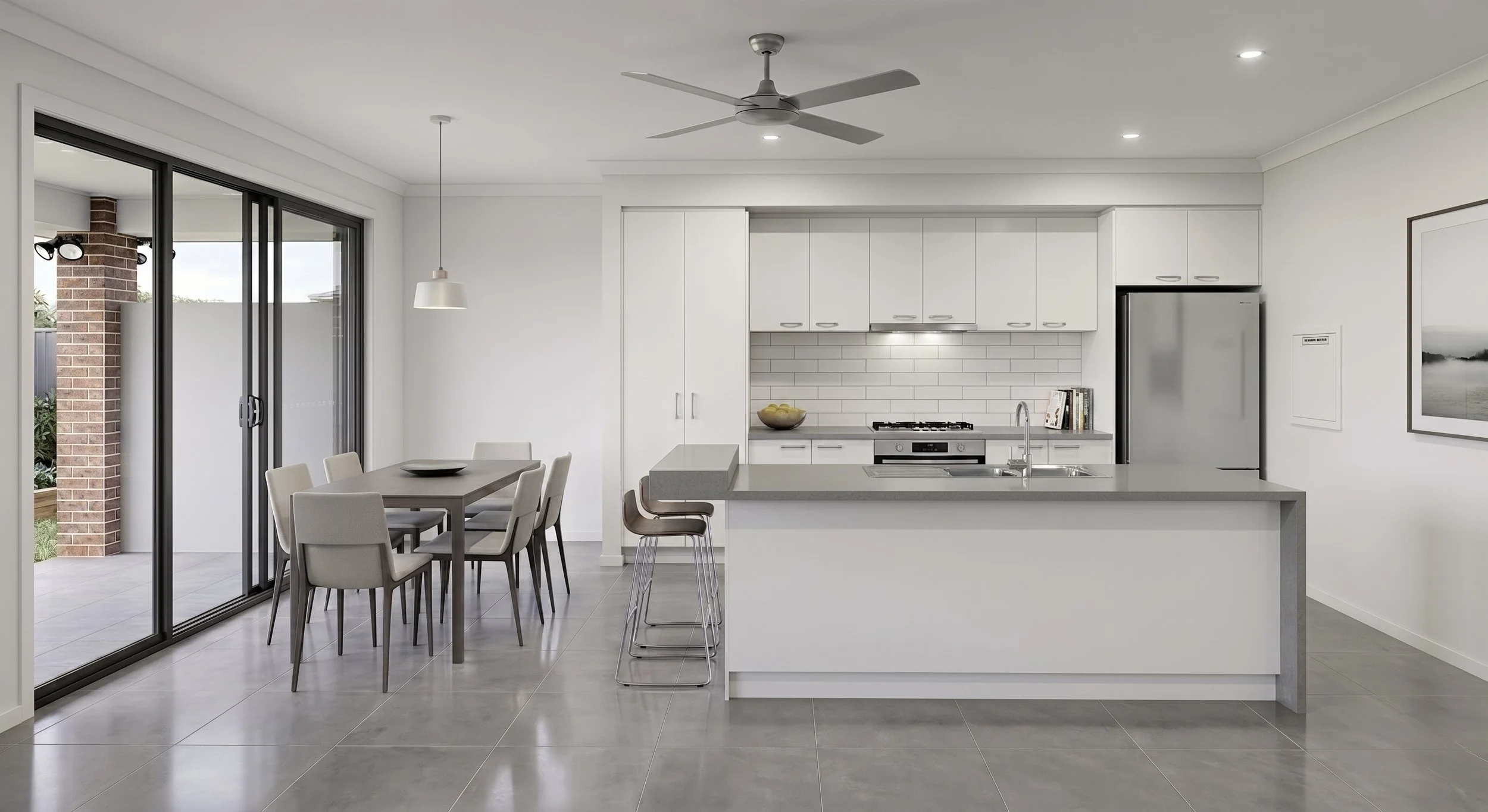 Modern kitchen with white cabinets, gray countertops, stainless steel refrigerator, and subway tile backsplash. Adjacent dining area with a wooden table and beige chairs, sliding glass doors leading outside, and a ceiling fan.