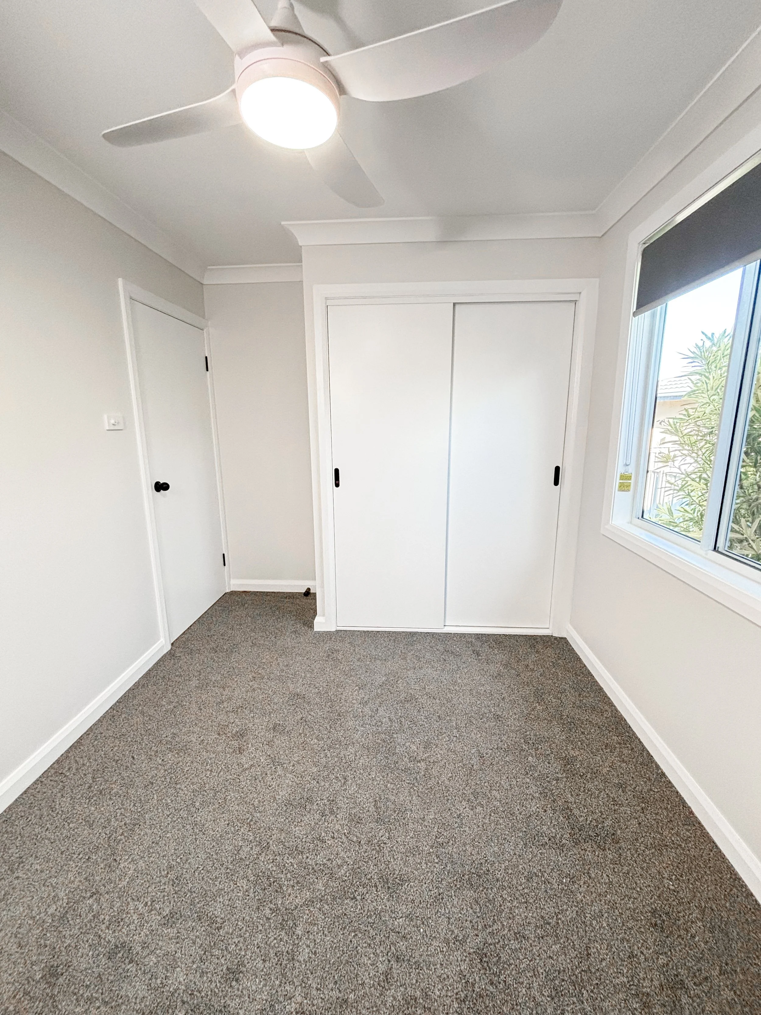 A modern, simple and functional bedroom renovation with  white walls, that makes the room clean and brighter by Whitbuild, Cowra NSW