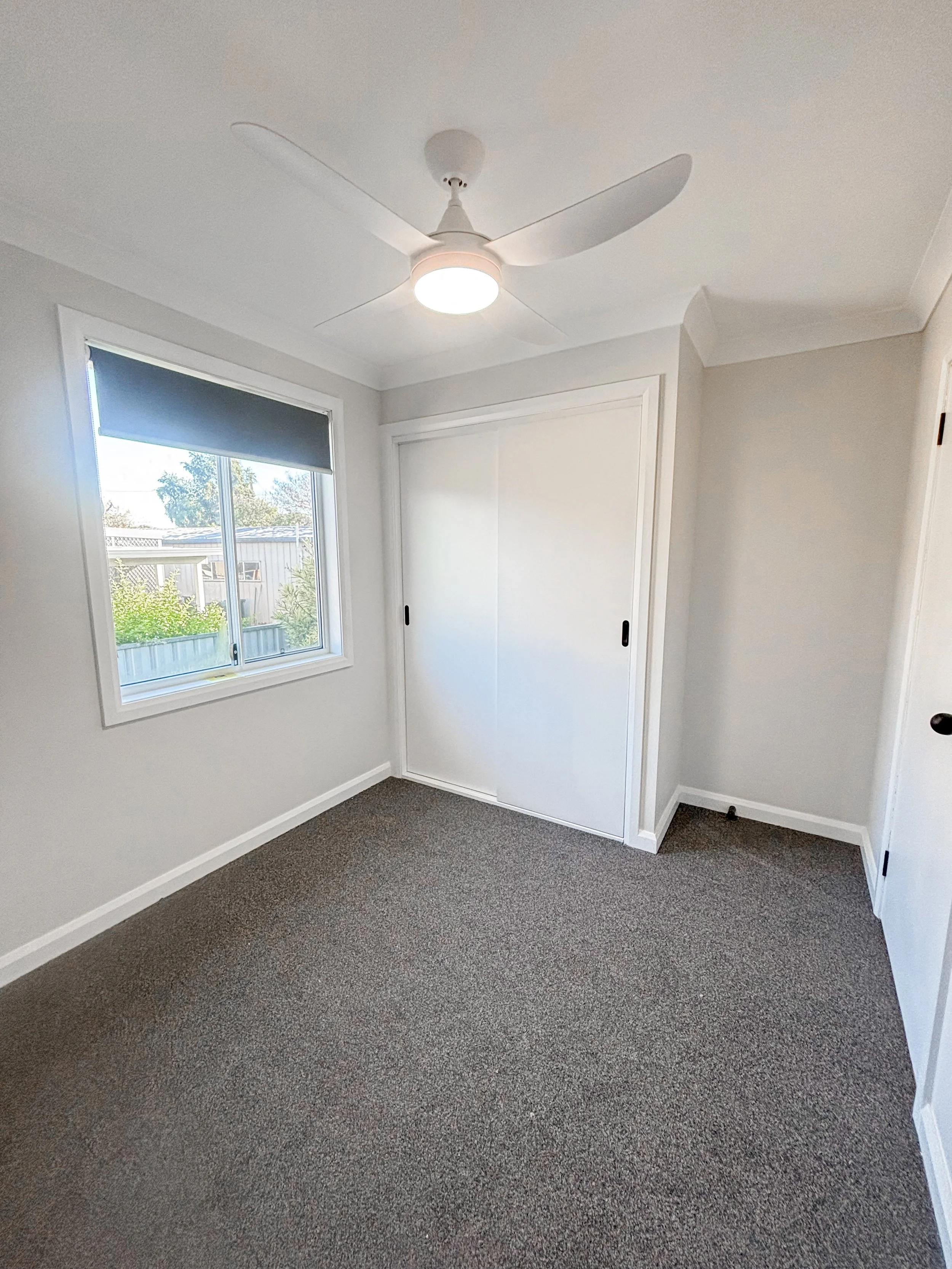 A modern, simple and functional bedroom renovation with  white walls, that makes the room clean and brighter by Whitbuild, Cowra NSW