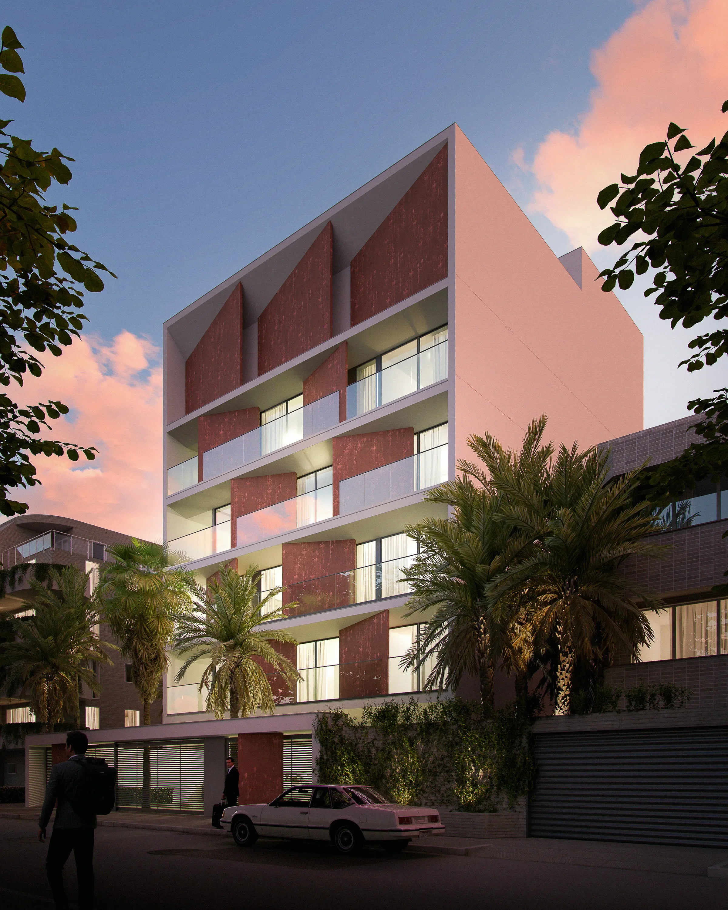Modern multi-story apartment building with large glass balconies and reddish-brown panels, surrounded by palm trees and a pink sunset sky.