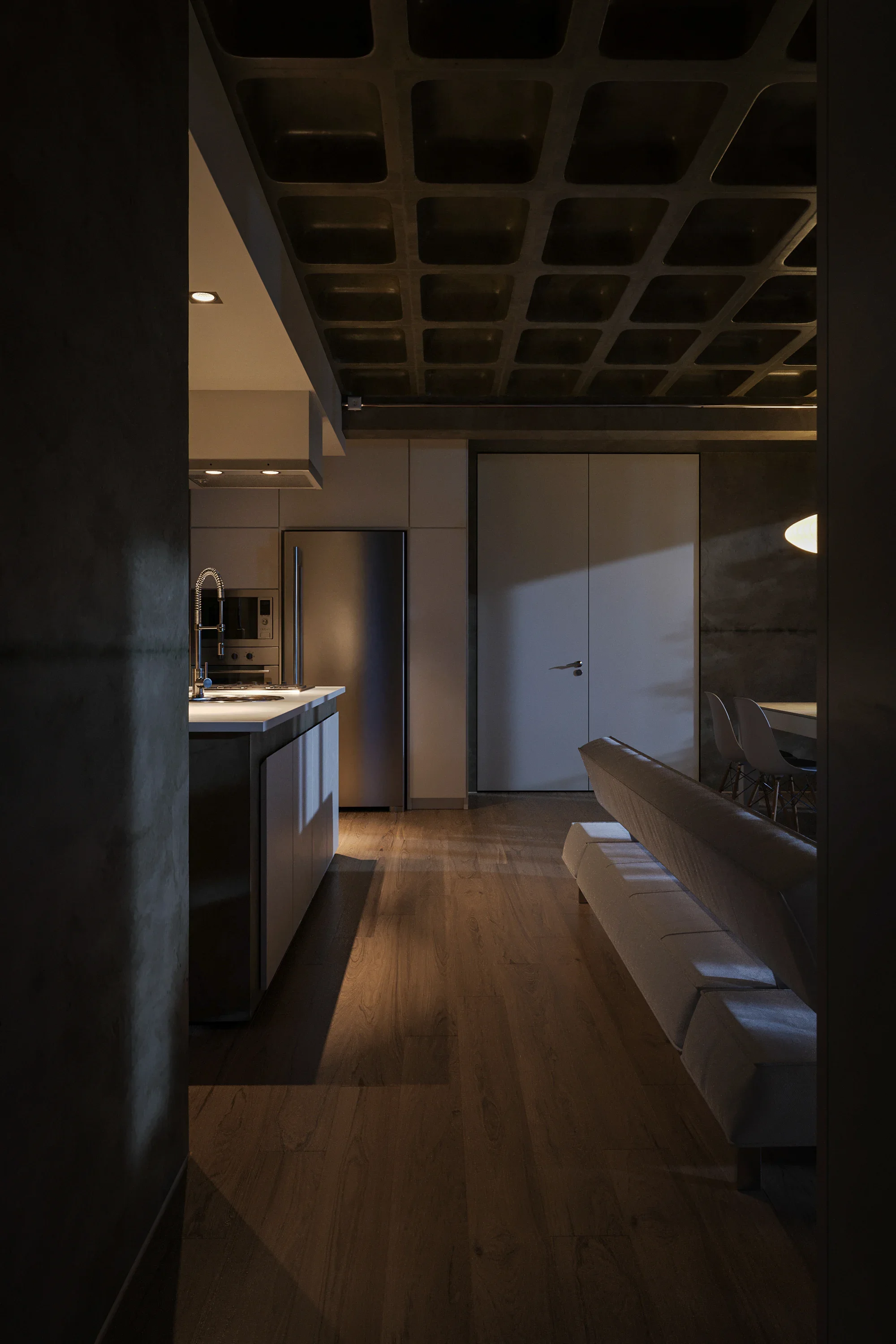 Interior of a modern kitchen with dark ceiling, stainless steel refrigerator, wooden floor, and minimalistic furniture.