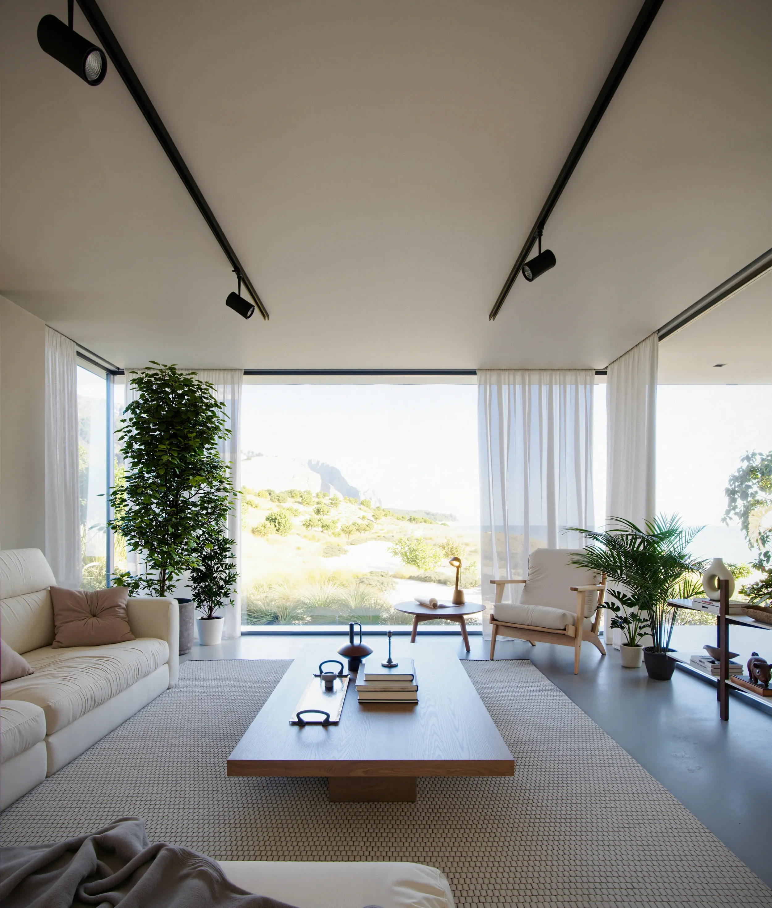 Living room with white sofa, armchair, potted plants, and large window overlooking a beach landscape, decorated in minimalistic style.