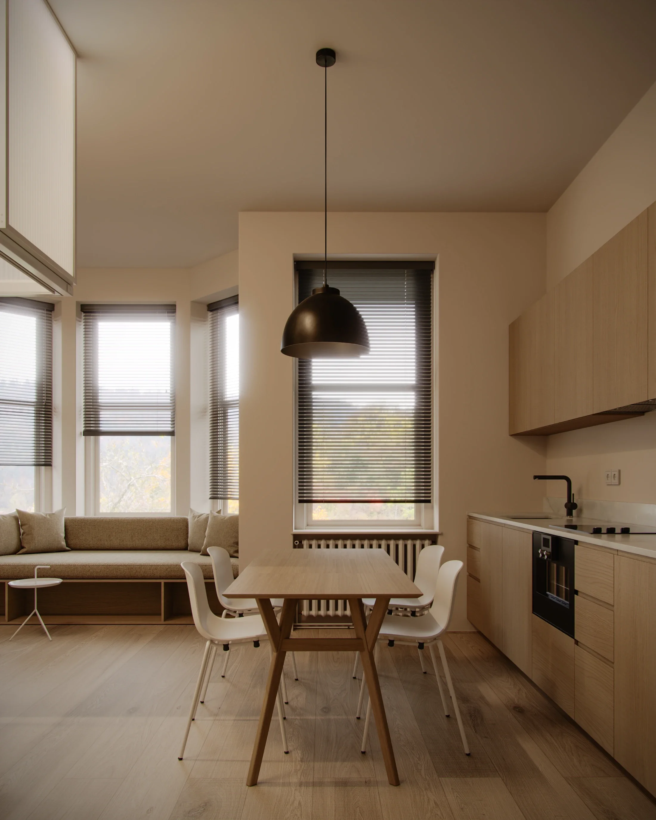 Minimalist dining area with wooden table, white chairs, black pendant light, beige sofa, windows with blinds, and a kitchen with light wood cabinets and black faucet.