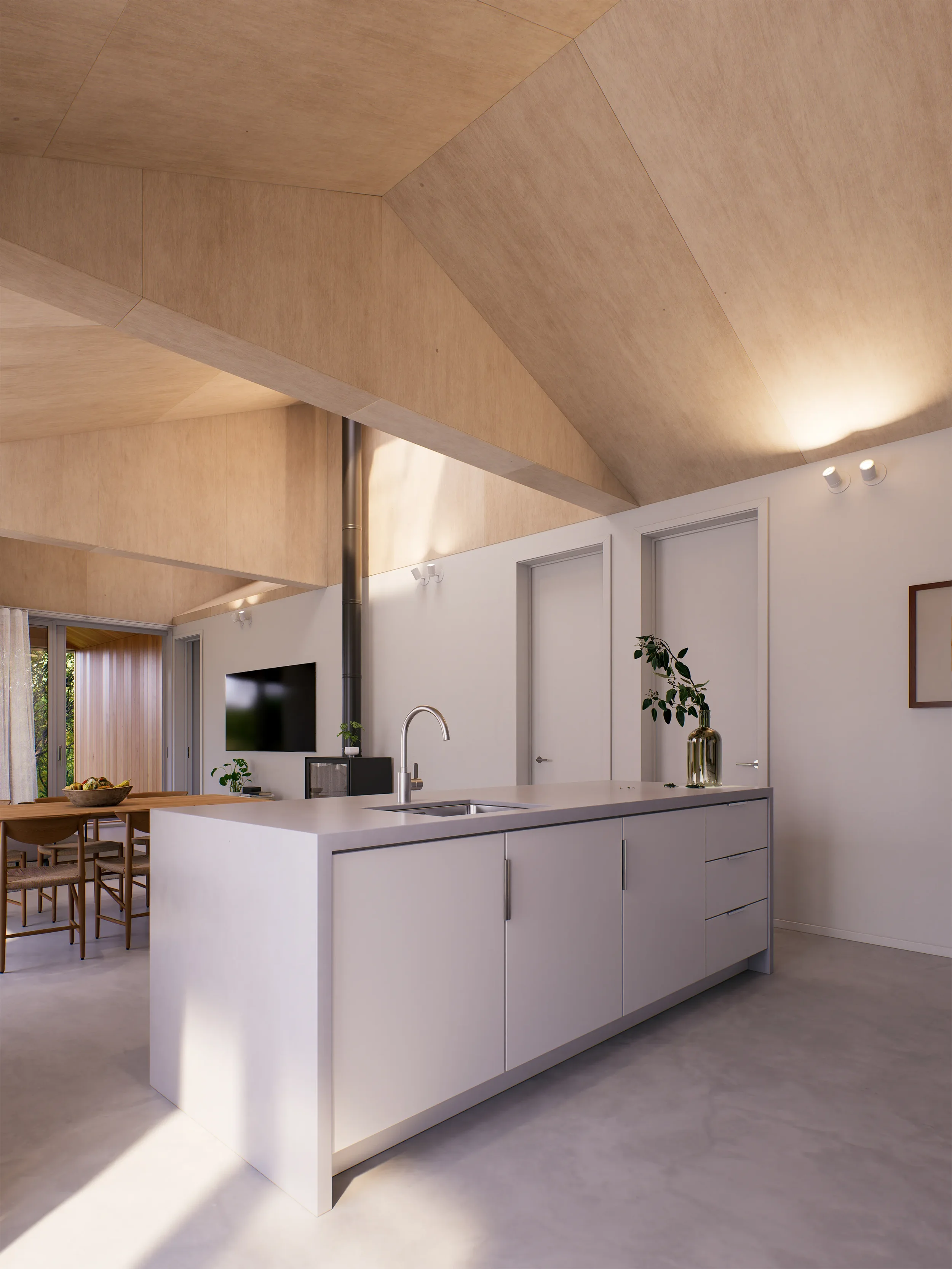 Modern, open-concept kitchen with white cabinetry, a central island with a sink, and a sleek black vent pipe. In the background, there's a dining area with a wooden table and chairs, and a sliding glass door leading outside. The ceiling has a unique