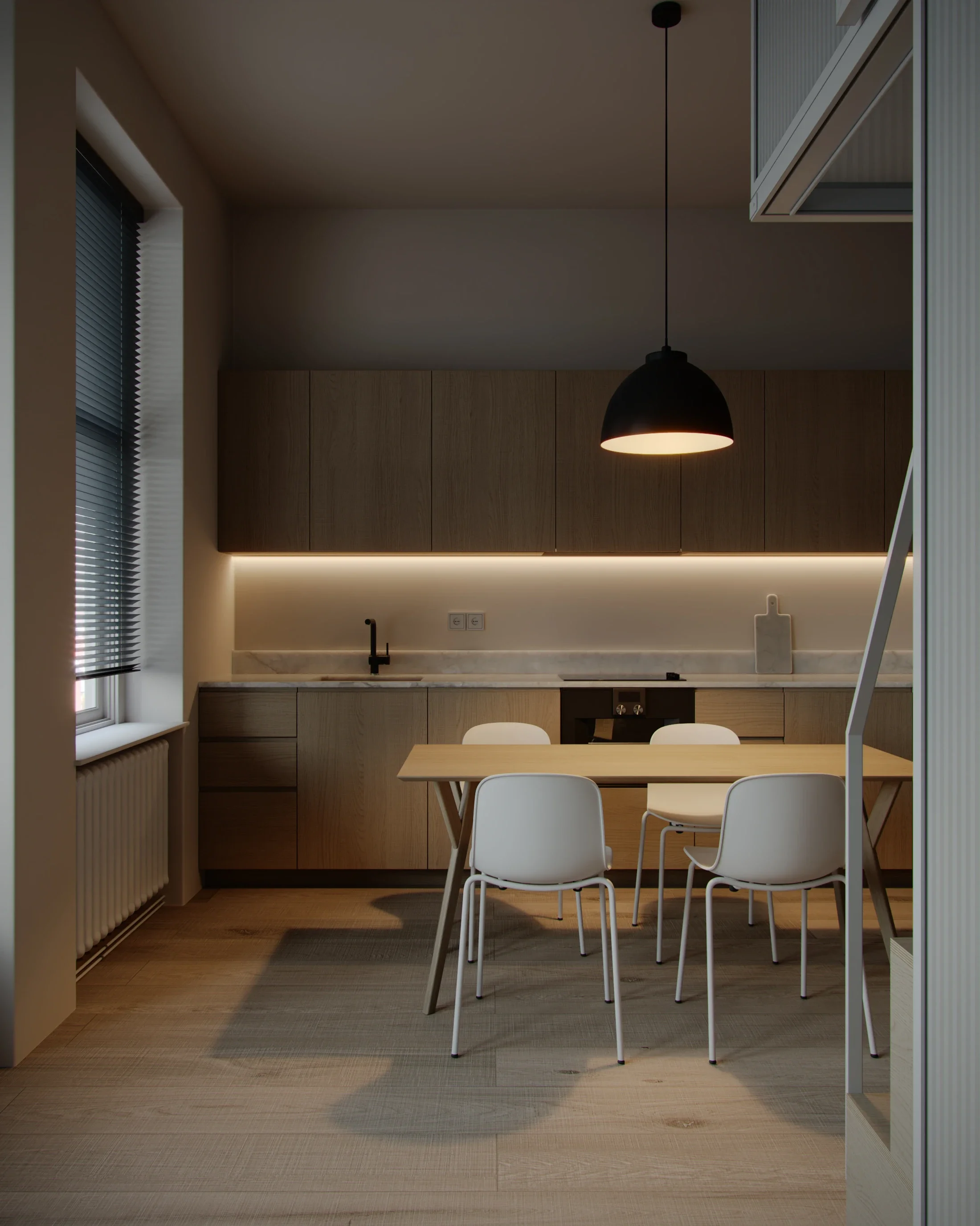 Modern minimalist kitchen with beige cabinets, a marble countertop, black faucet, and a black pendant light hanging above a wooden dining table with white chairs. There is a window with blinds on the left.