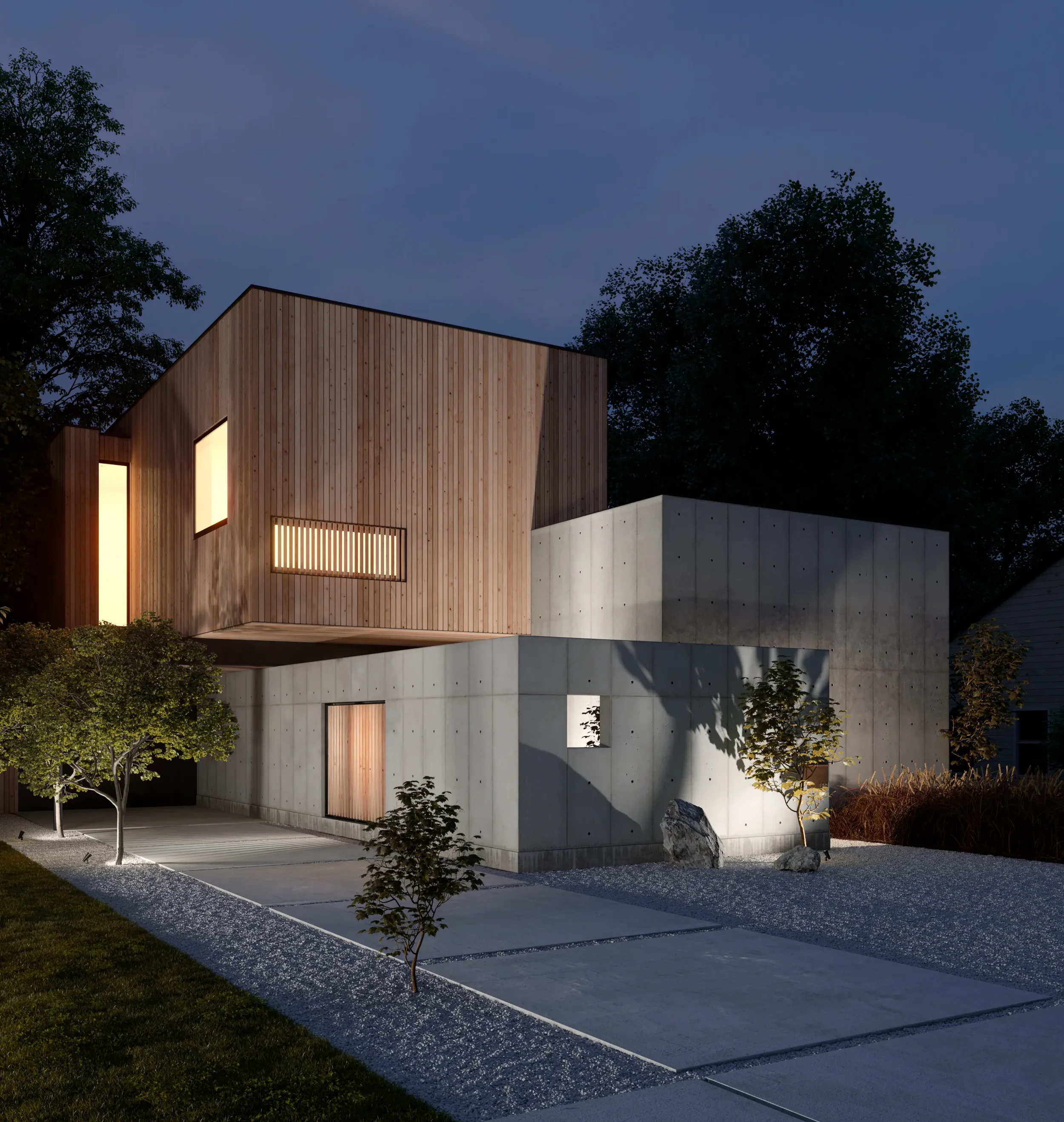 Modern residential house at night with wooden and concrete exterior, illuminated windows, landscaped yard with small trees, rocks, and pathway.