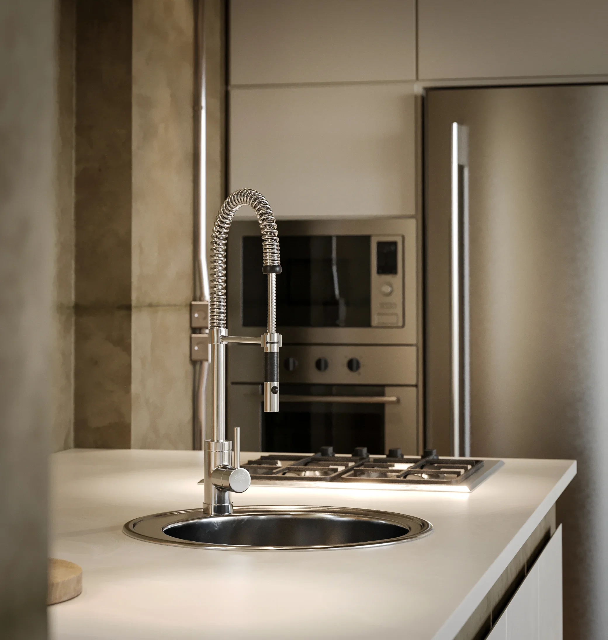 Modern kitchen with a stainless steel sink and faucet, built-in oven and microwave, and a gas cooktop on a white countertop.
