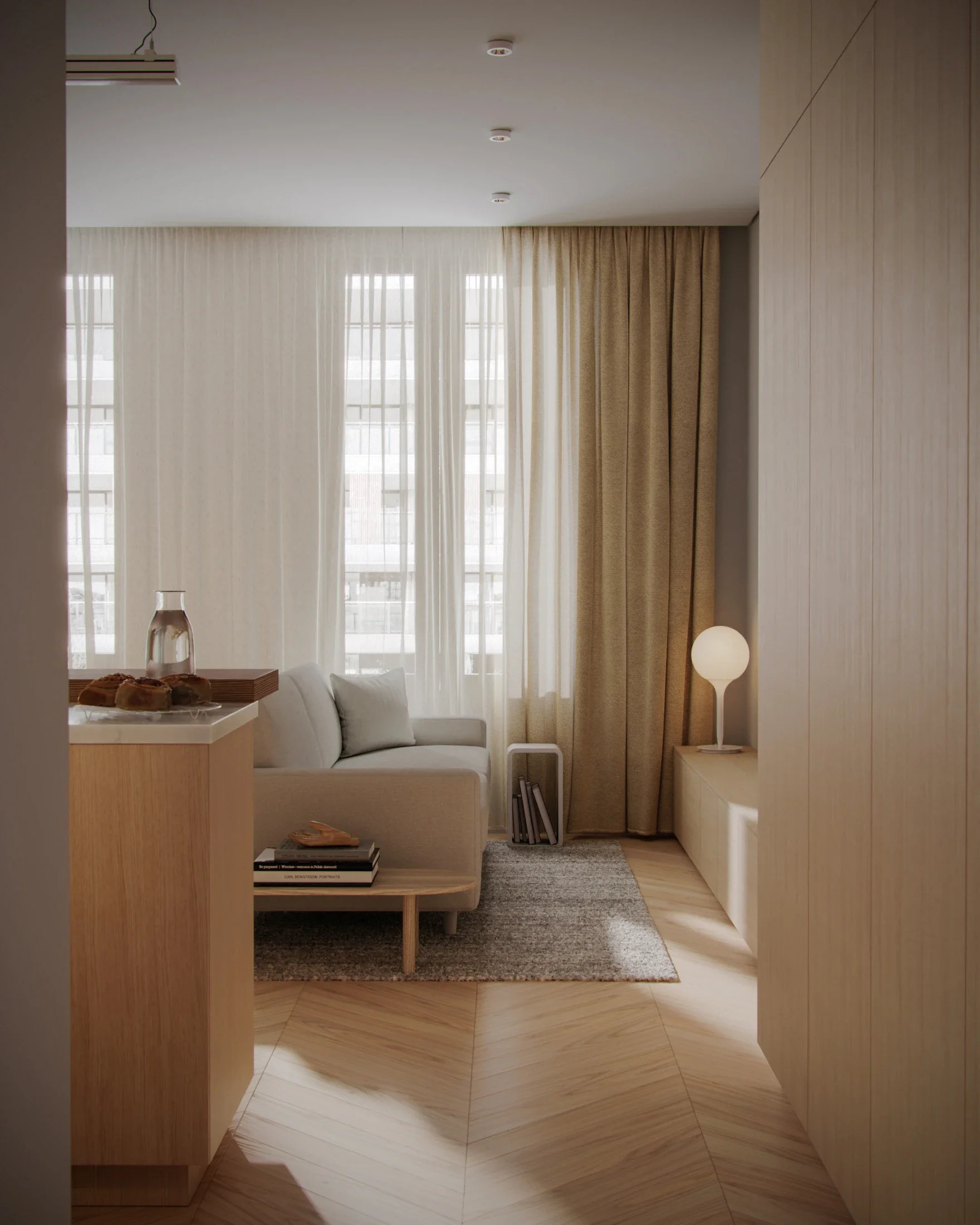 Cozy living room with white sofa, beige curtains, a small side table with a lamp, a wooden coffee table, and a large window with sheer curtains letting in natural light.