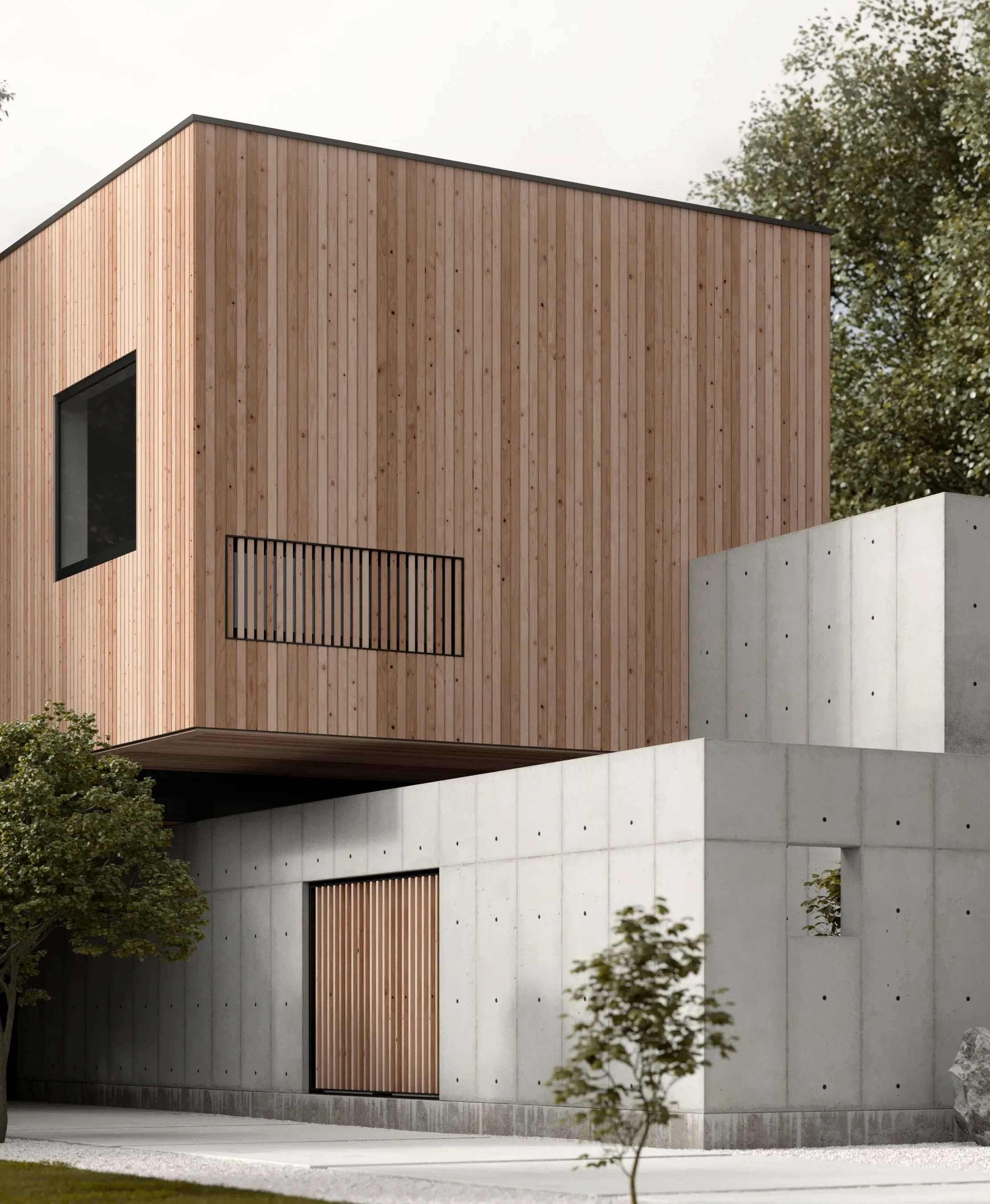 Modern two-story house with a wooden upper level and concrete lower level, featuring a small window, a balcony with a black railing, and a wooden sliding door, surrounded by trees and a sidewalk.