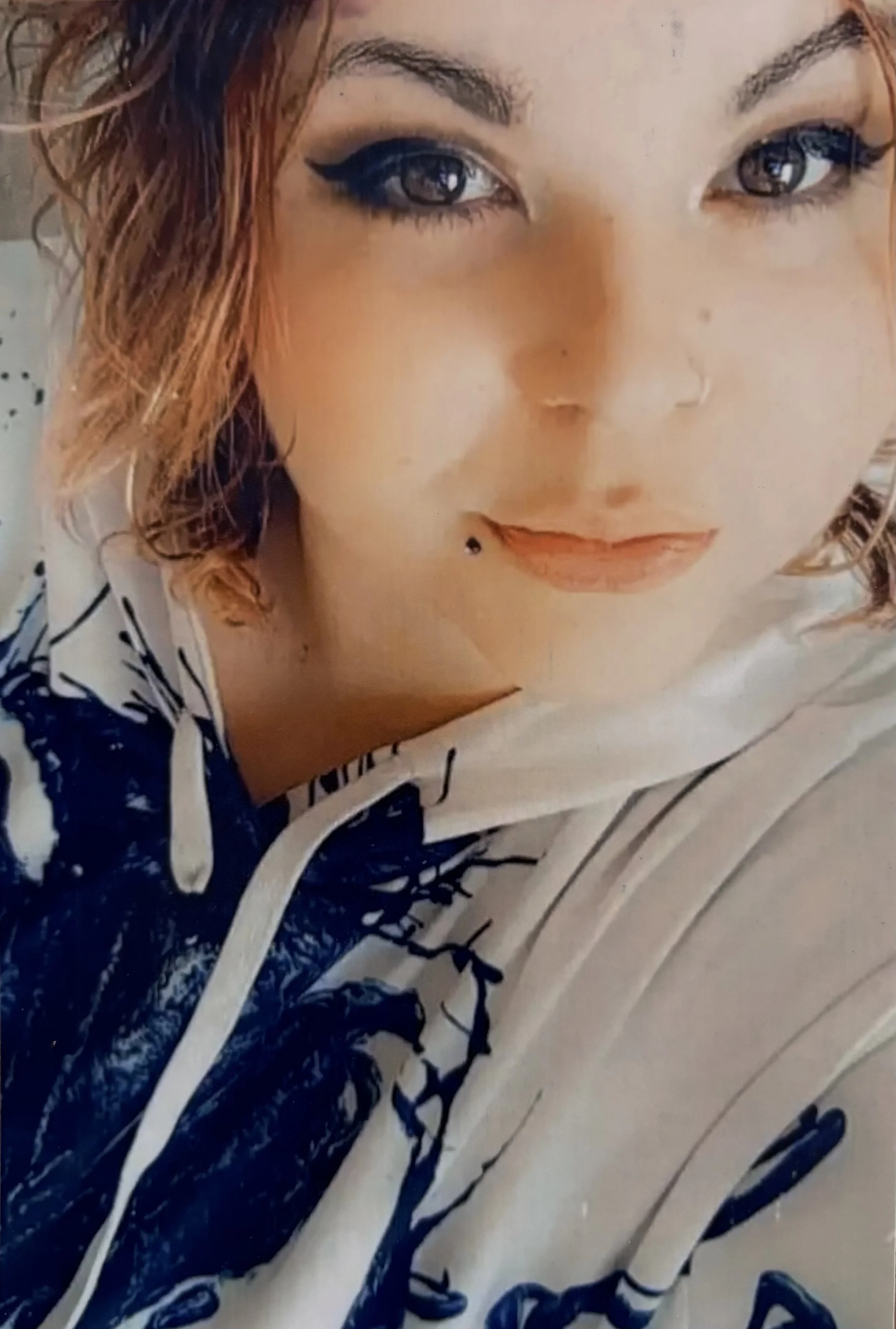 Photo of a person with orange and black hair