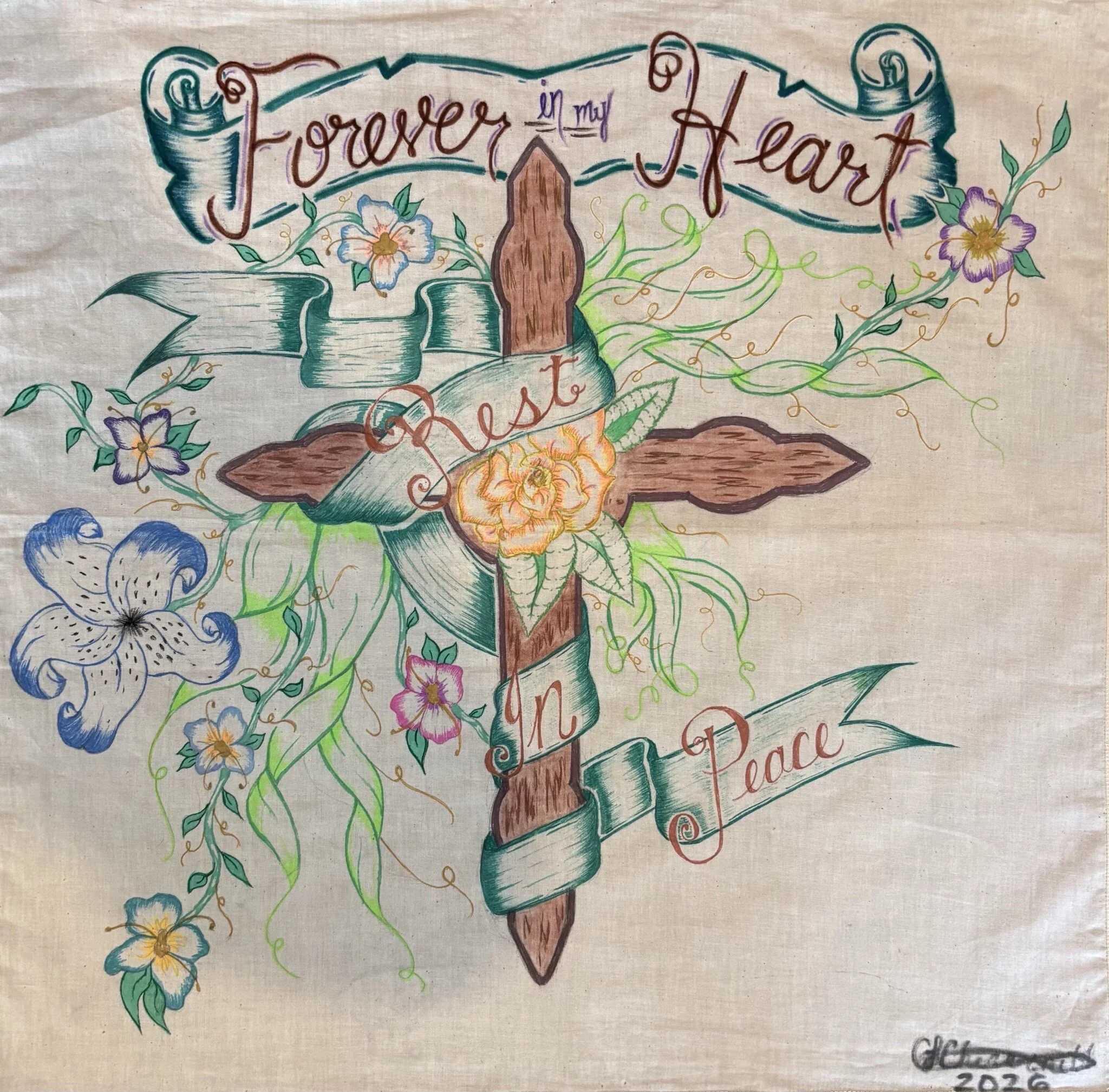 "Rest In Peace" / 2025 / Pencil, markers, and gel pen on fabric / 21" x 21" / FOR SALE $125. A wooden cross wrapped in a green ribbon with the words "Rest In Peace". In the center of the cross is a yellow flower and there are multi-colored flowers an