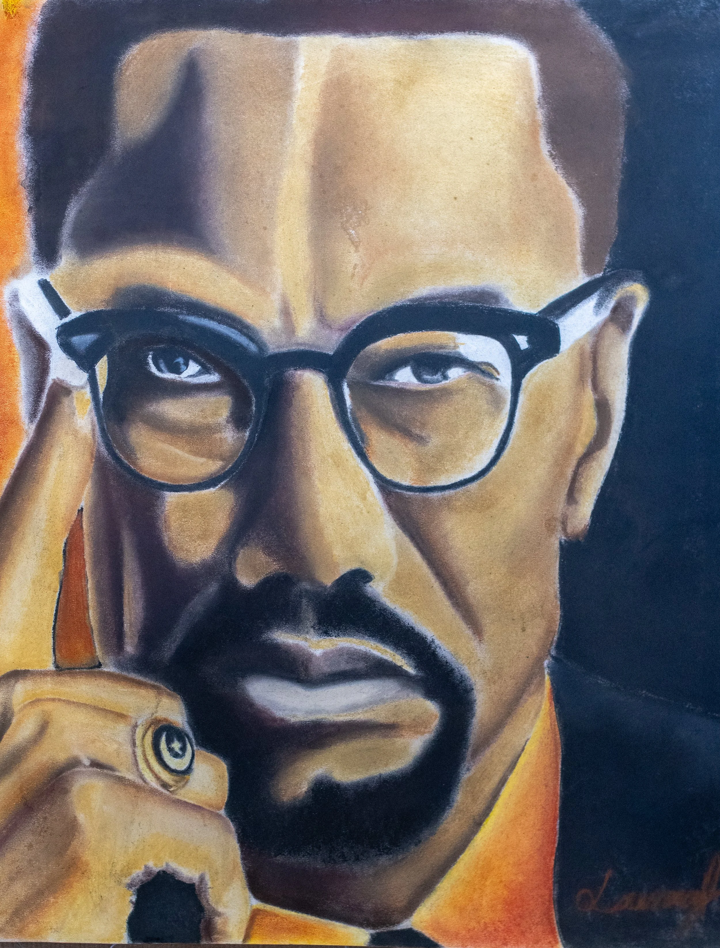 "Malcolm X", pastel, 2025. Portrait of Malcolm X with his hand resting on his face, looking thoughtful