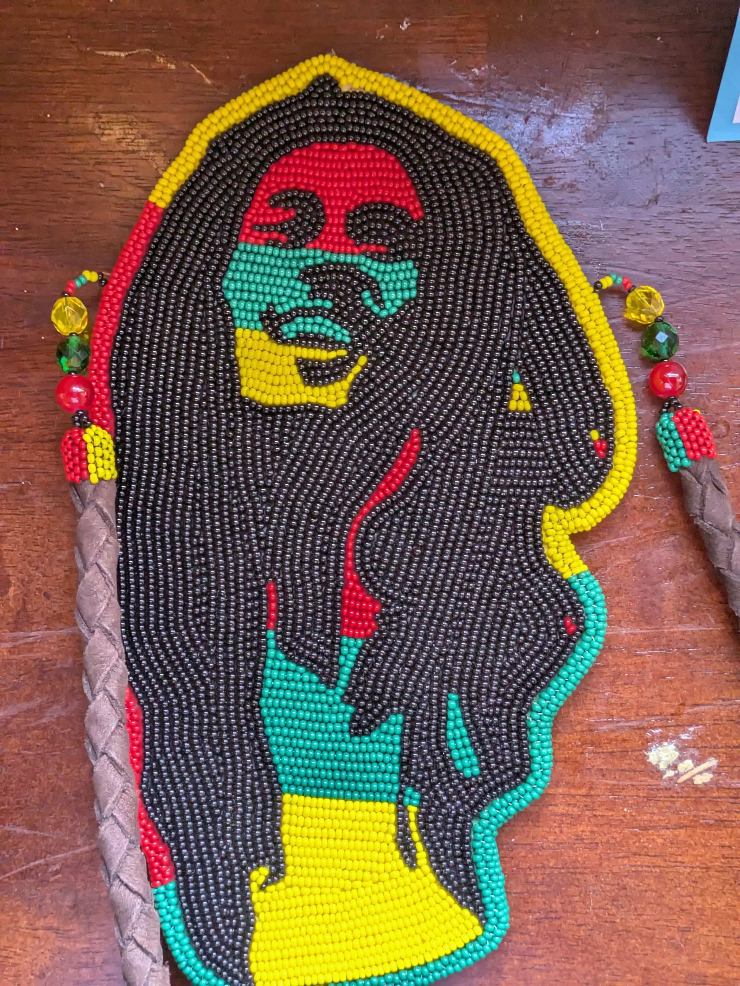 Portrait of Bob Marley in red, yellow, and green (colors of the Rastafari flag)