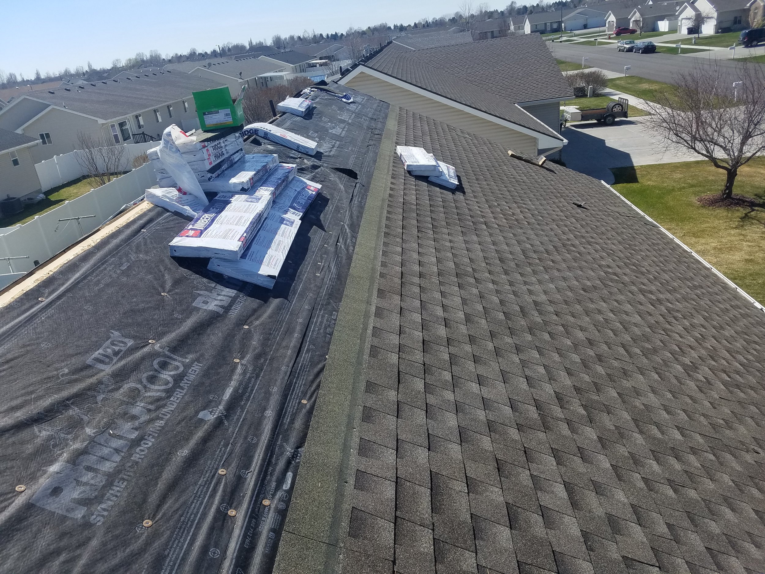 Roof with shingles and construction materials