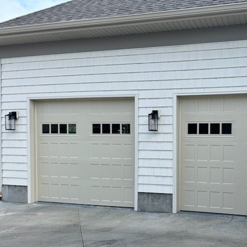 New vinyl siding installation, new garage door wraps.