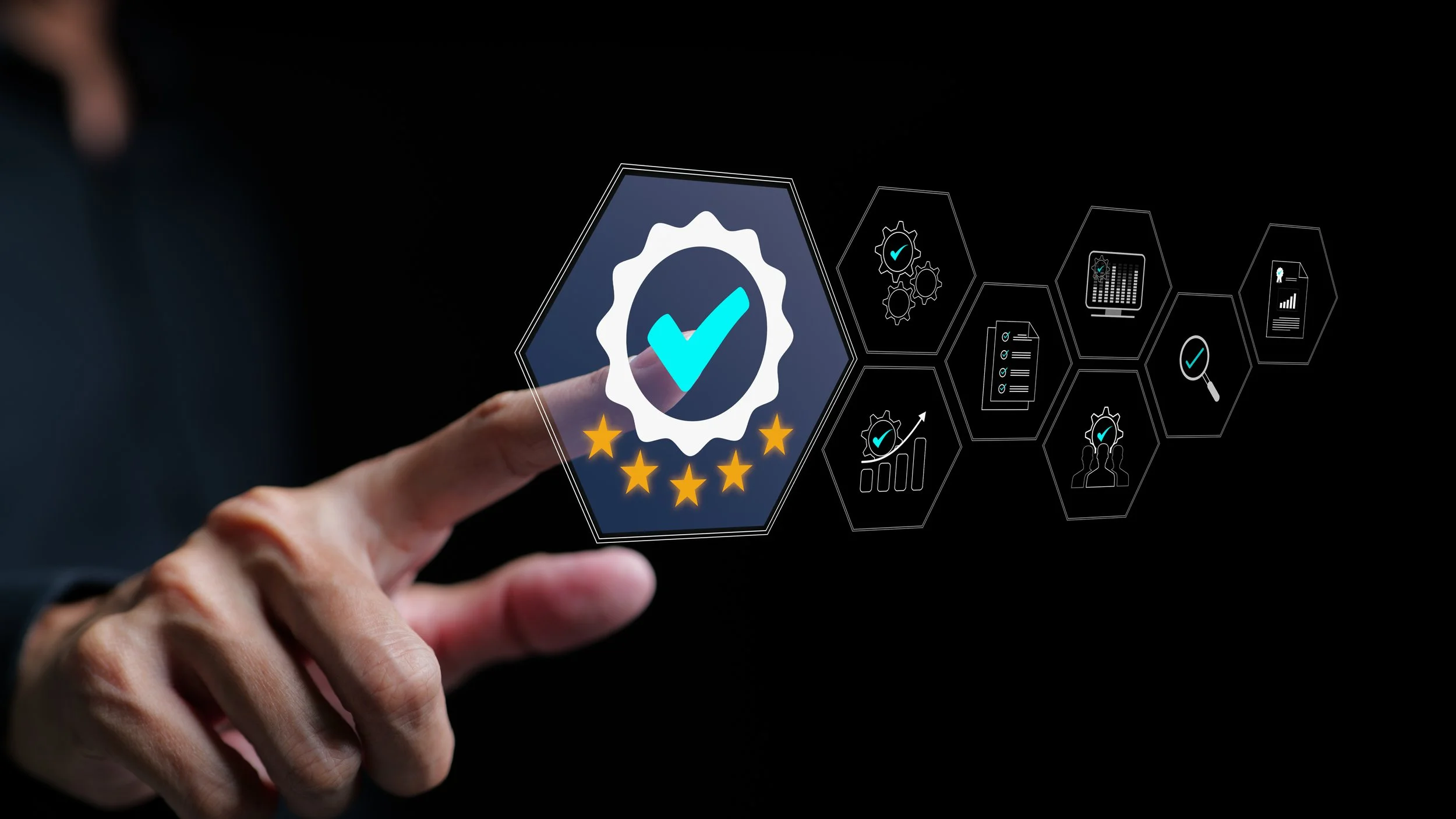 Hand pointing to a digital interface with a badge icon featuring a checkmark and stars, surrounded by various icons representing technology and analytics on a dark background.