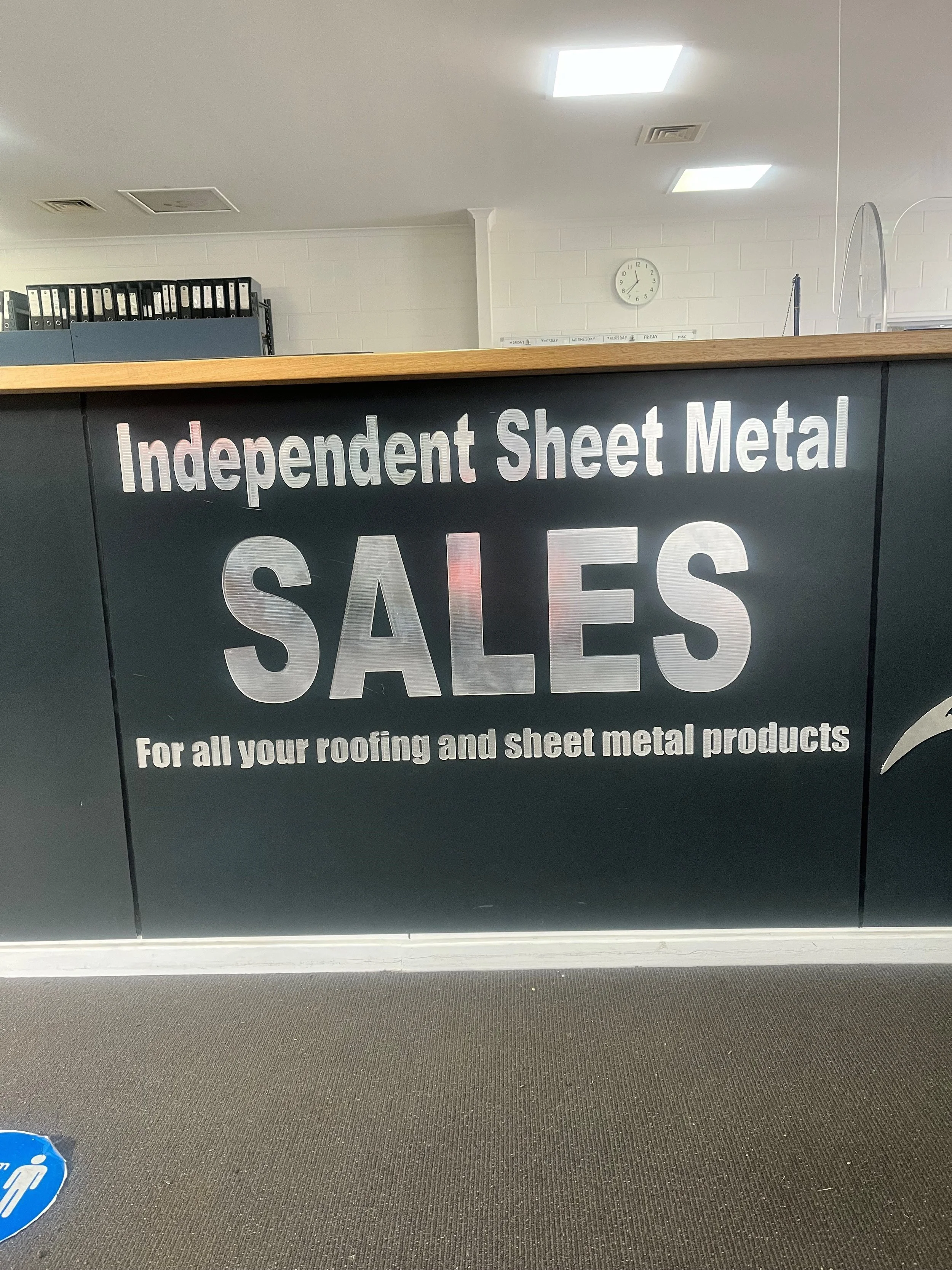 Oranssi technician working on a roof project