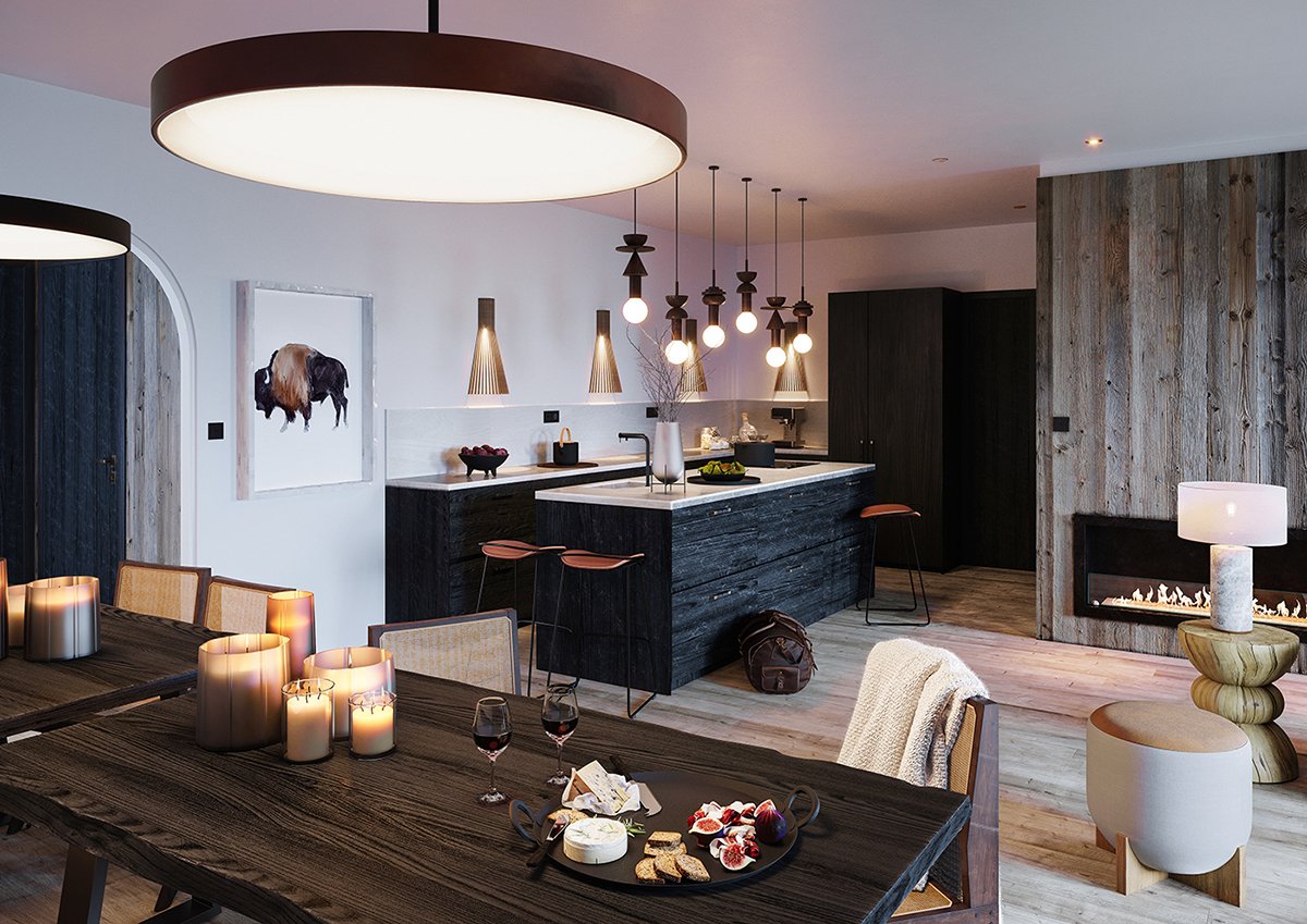 Intérieur de cuisine moderne avec un plan de travail en marbre blanc, éclairage suspendu, cheminée électrique, table à manger en bois avec bougies et verre de vin, décoration chaleureuse et design contemporain.