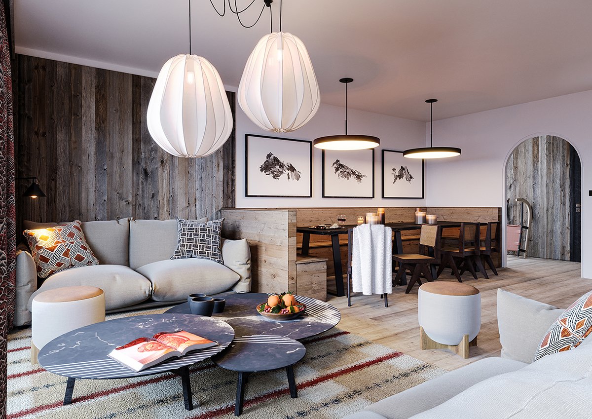 Salon de style rustique avec canapé beige, deux tables basses en marbre, lampes suspendues modernes, table à manger en bois avec chaises, décor de montagnes en noir et blanc, murs en bois et tapis