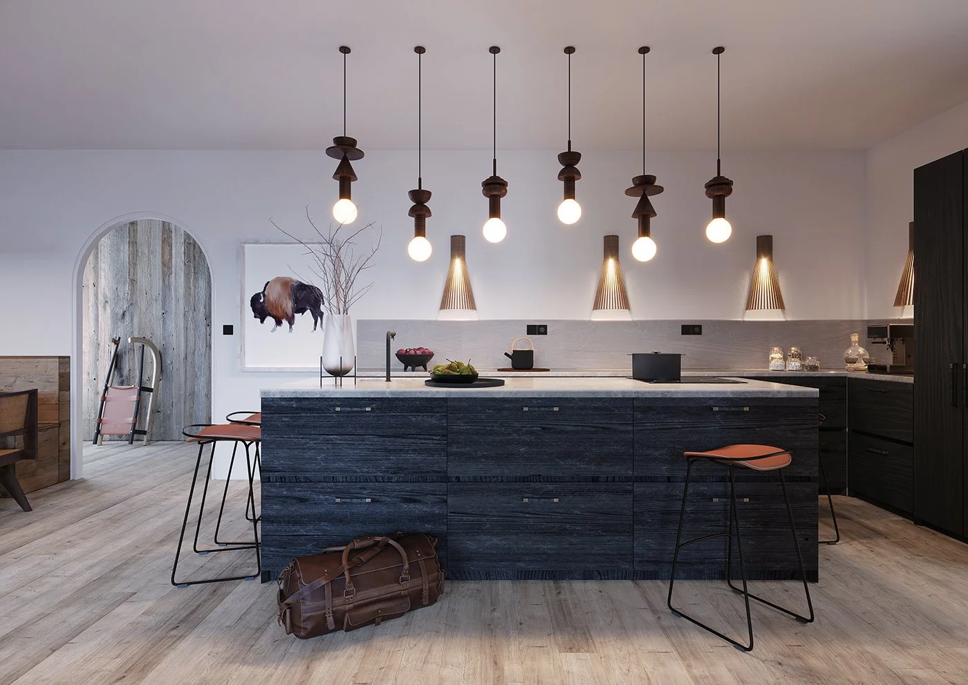 Cuisine moderne avec îlot central en bois foncé, éclairage suspendu, et décoration simple.