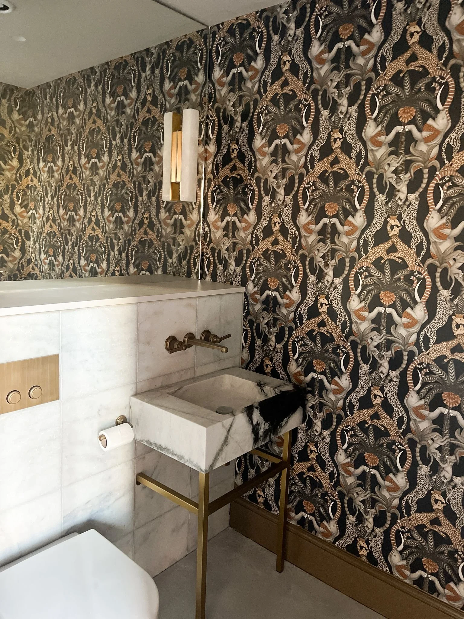 High-end interior design Cobham WC wallpaper marble sink
