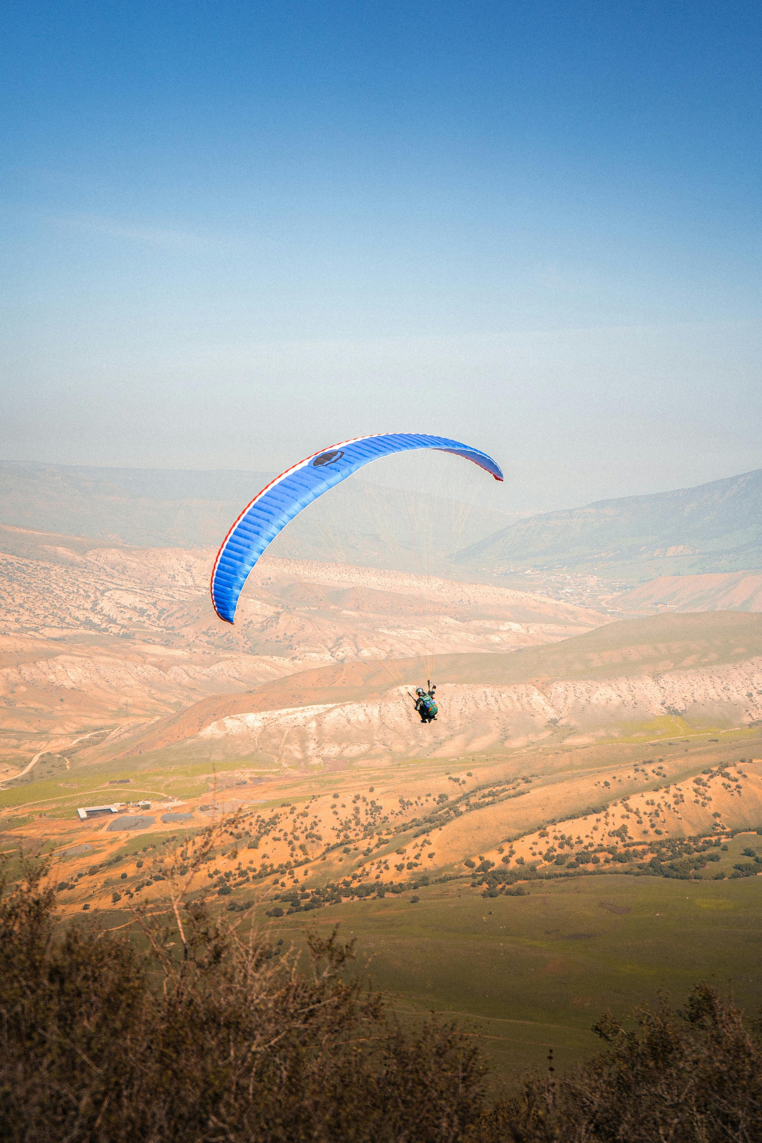 Paragliding in Marrakech. Experience the thrill of soaring high above the stunning landscapes of Morocco, with panoramic views of the Atlas Mountains, desert, and valleys. Glide through the skies on an exhilarating paragliding adventure, perfect for