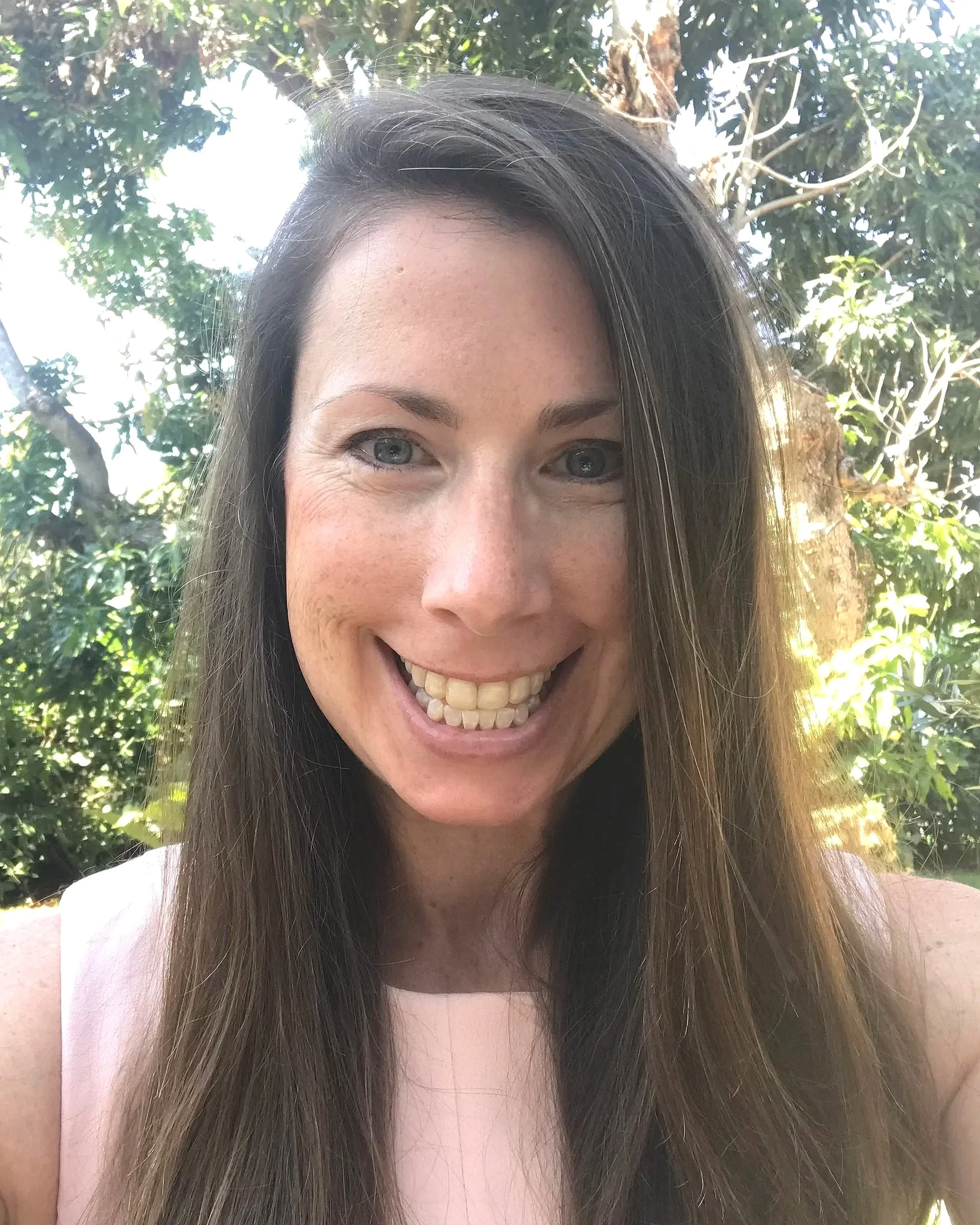 A woman in nature who believes in the healing power of EMDR and trauma therapy for midlife and menopausal women.