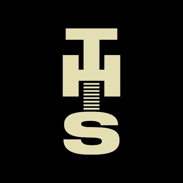 A black background with a beige symbol combining a key and the letter S.