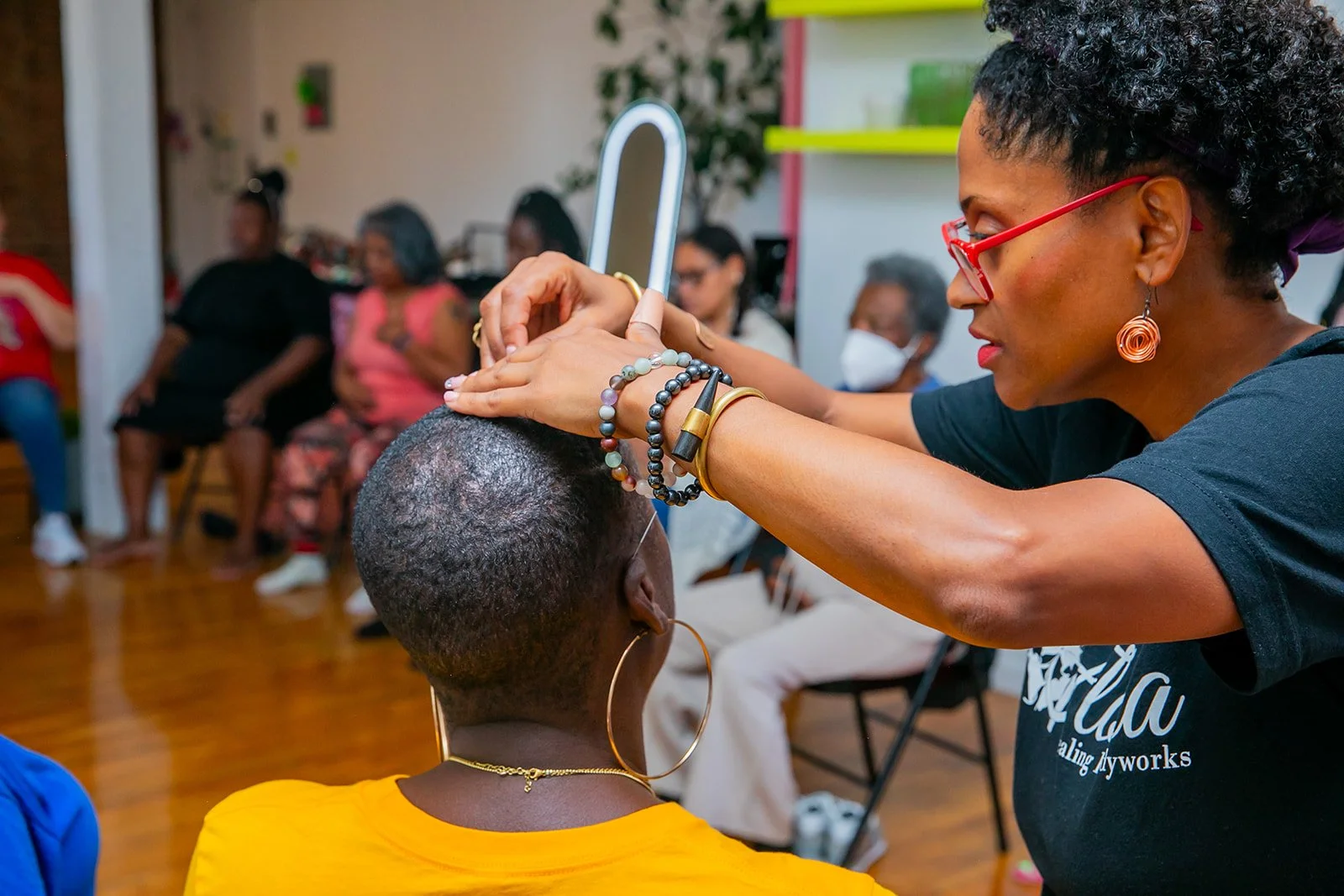 Dr Flora Luyando administering Acupuncture