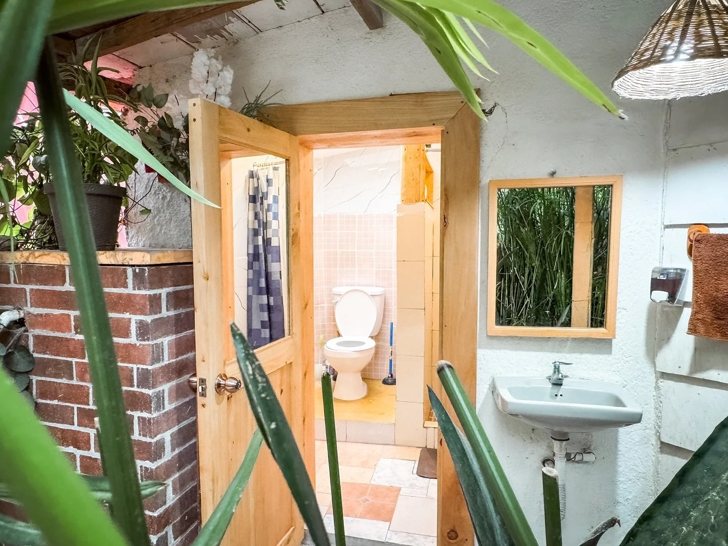 Simplicity has its own kind of beauty 🌱

The wooden door, the gentle play of light, and the greenery mirrored in the glass &mdash; together they create a feeling of freshness and warmth. This is more than just a bathroom; it&rsquo;s a space that ref
