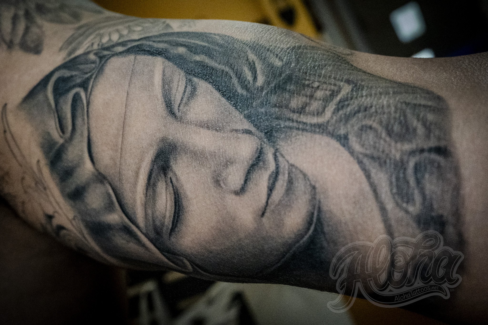Black and grey illustrative tattoo