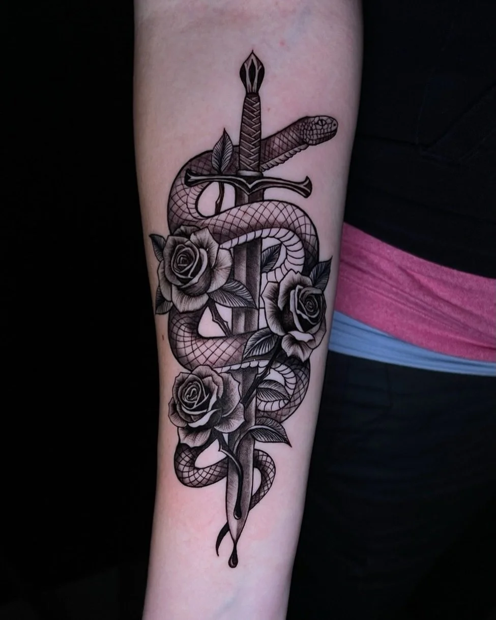 Snake wrapped around sword tattoo incorporating roses ⚔️🐍🌹
-
-Artist: @deadsoul.ink🔥
-Aloha Tattoos 🌺📍
-Walk-ins welcome everyday✨
-comment &ldquo;consult&rdquo; for a free consultation! 
-
-
#blackandgraytattoos #snakeandswordtattoo #rosetattoo