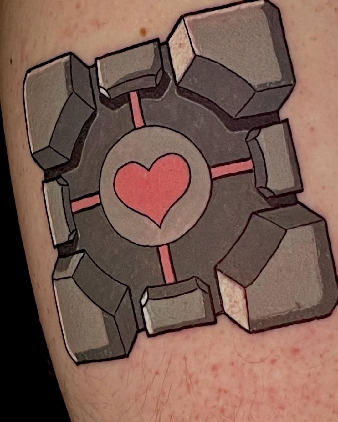 Kevan - @kevant13 is tattooing at @alohasaltlake give them a follow! - The weighted companion cube. Loved working on this piece! 🧊🥰🧊 . . . #colortattoo #gamingtattoo #portaltattoo #utahtattooartist #stickertattoo